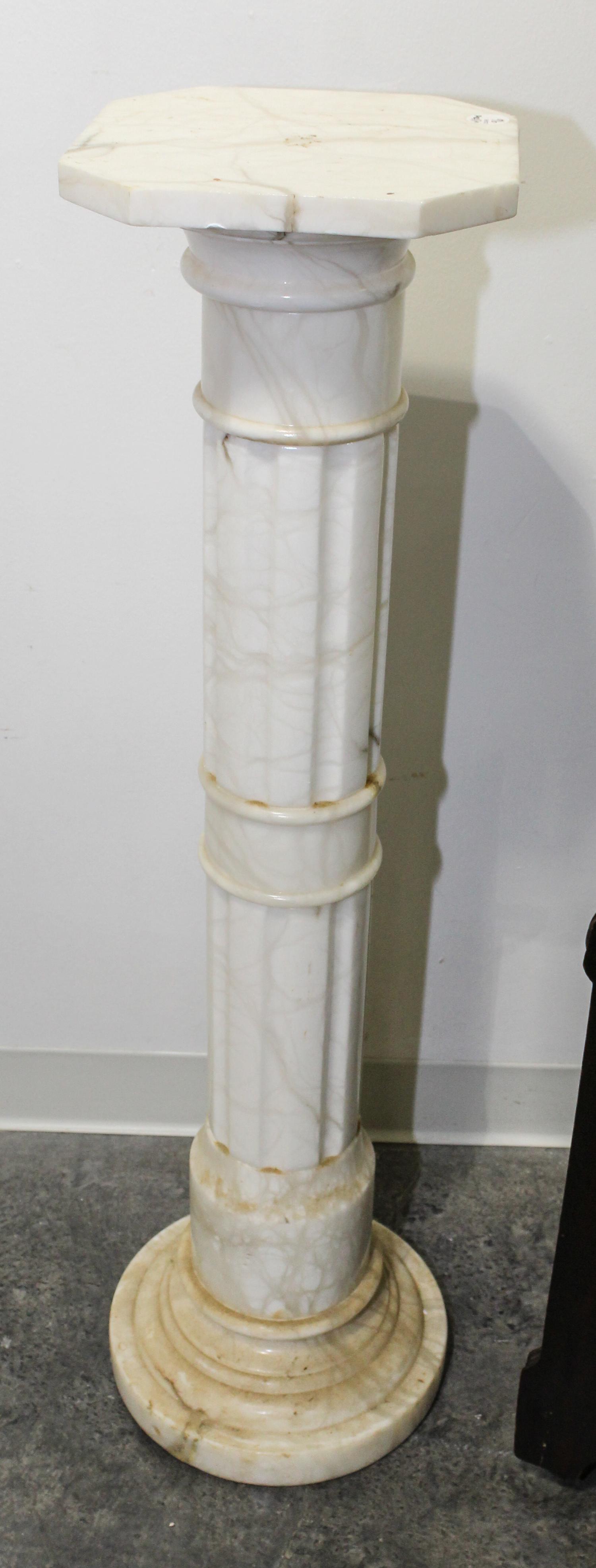 A Continental Marble Pedestal. Height 40 inches.