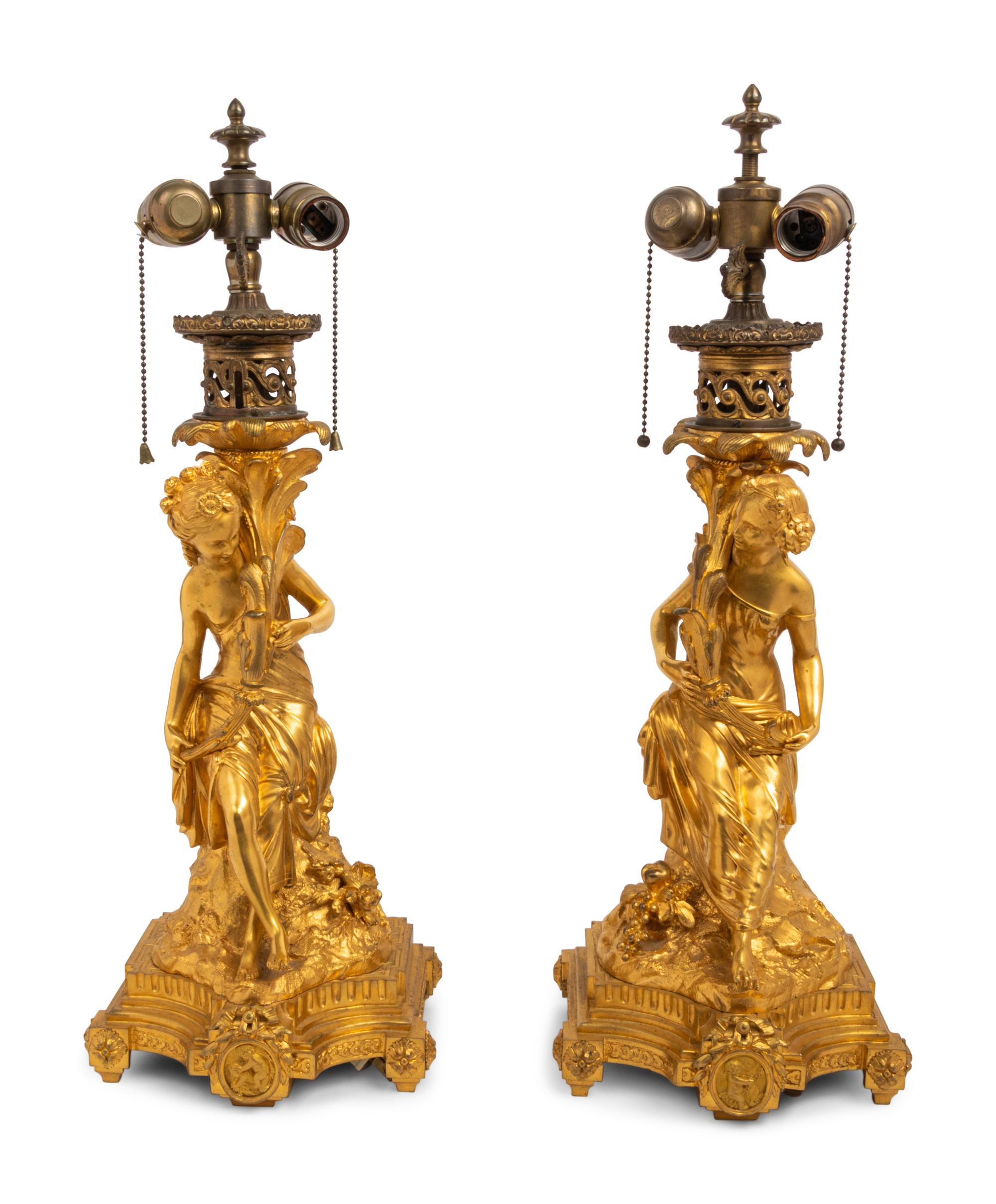 A Pair of French Gilt Bronze Figural Fluid Lamps Converted to Electricity