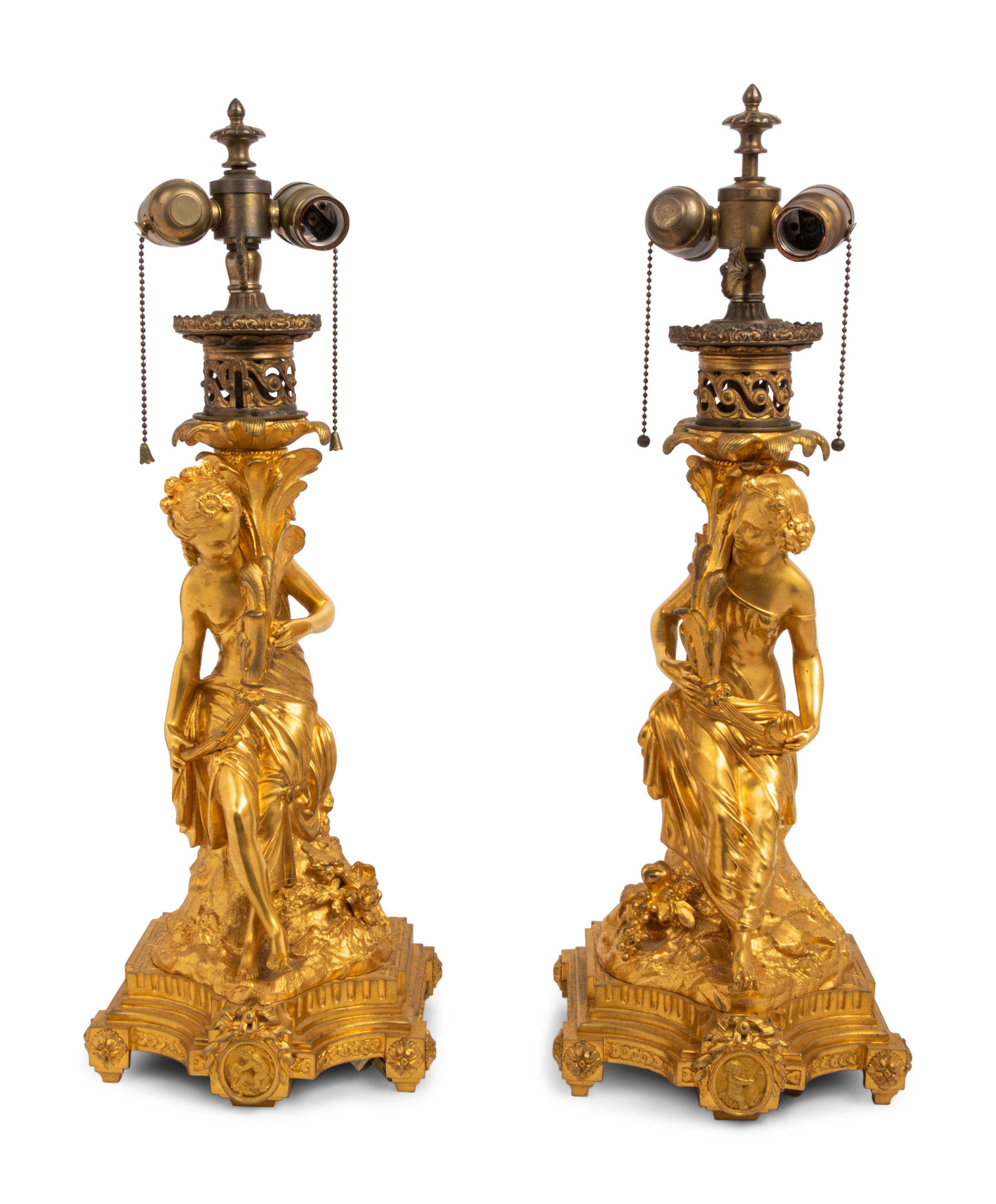 A Pair of French Gilt Bronze Figural Fluid Lamps Converted to Electricity