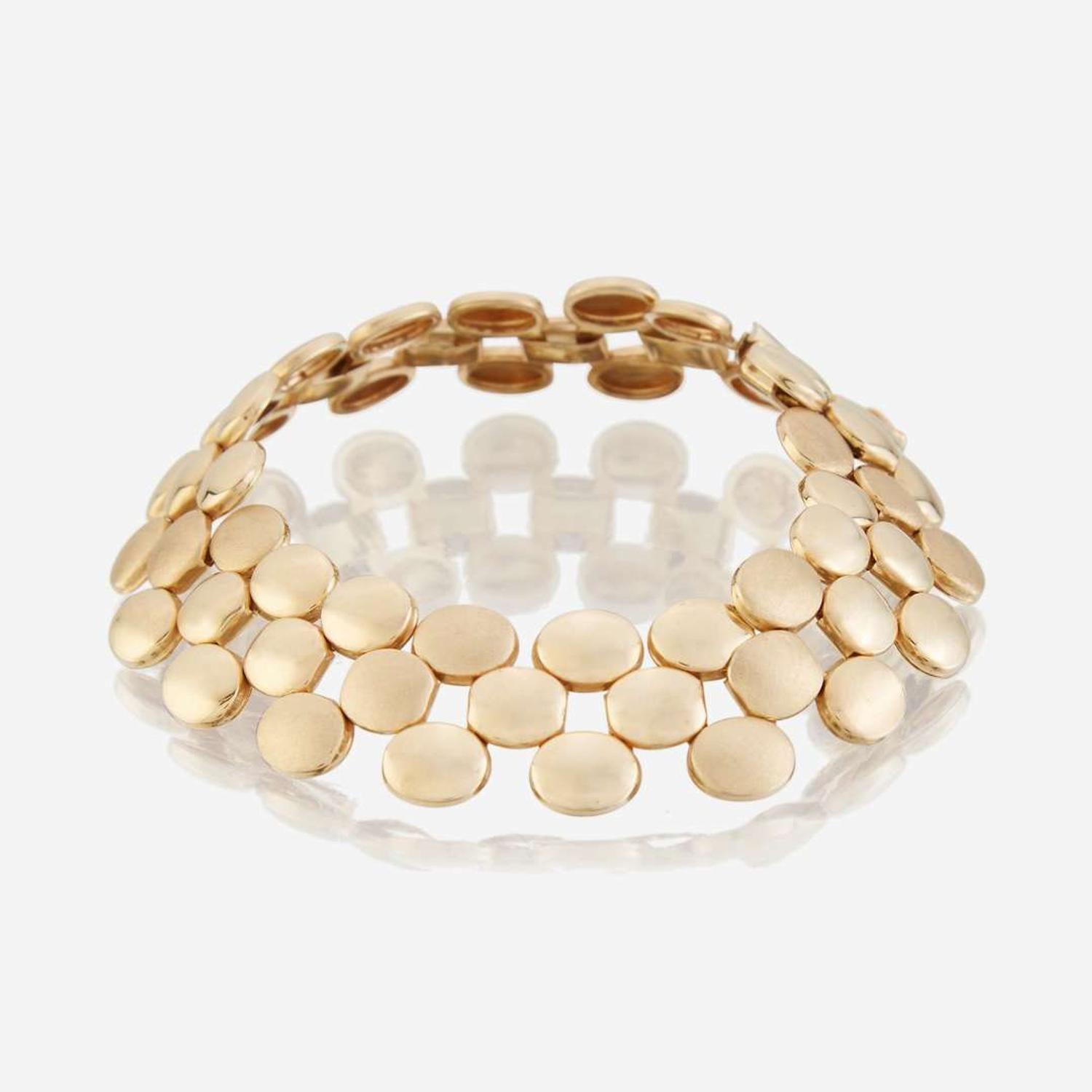 A collection of five fourteen karat gold bracelets