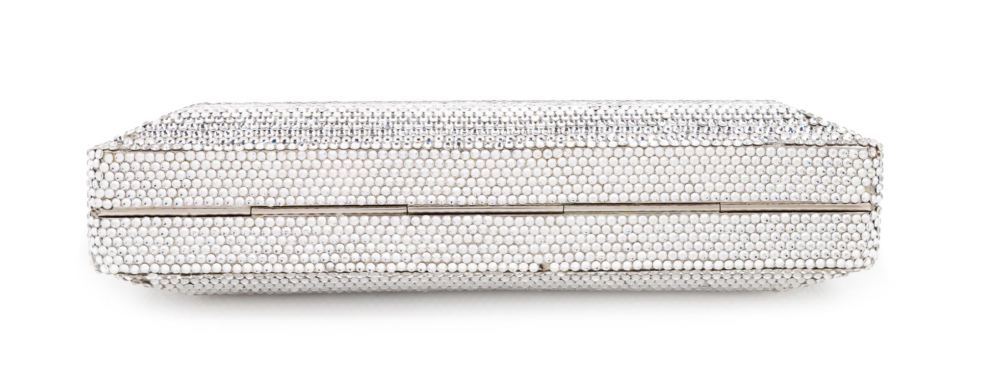 A Judith Leiber Silver Crystal Minaudiere, 3.5" H x 8" W x 1.25" D.