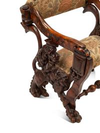 An Italian Carved Walnut Low Armchair