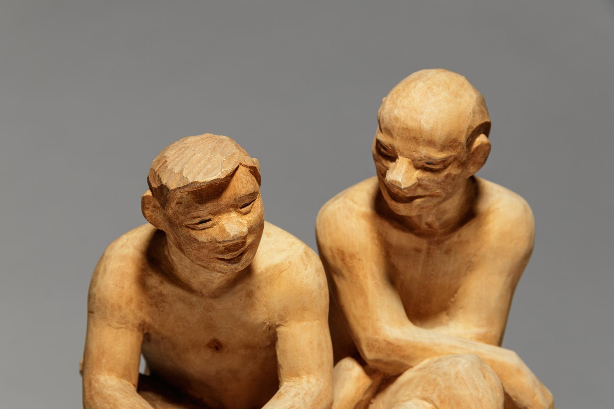 Two Seated Figures