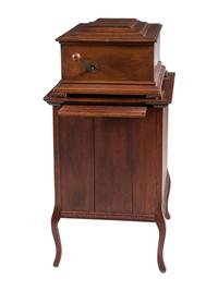 A Mira Mahogany-Cased Disc Music Box and Cabinet