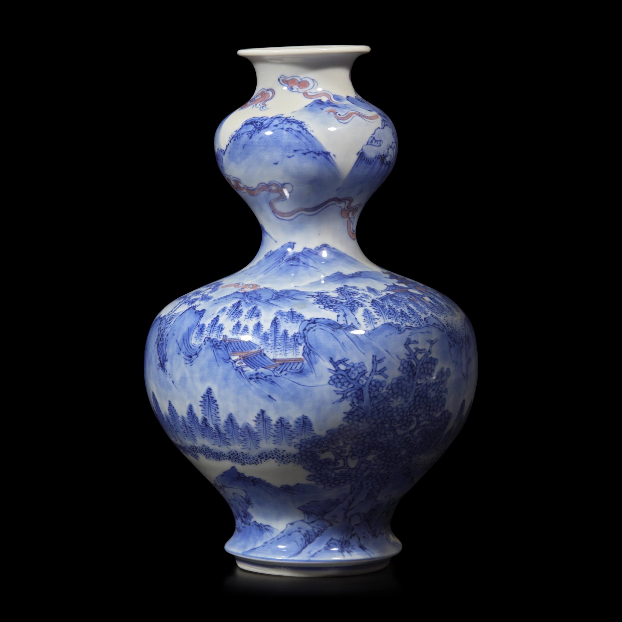 A Japanese Blue and White and Copper Red Glazed Double Gourd 'Landscape' Vase, Signed Dai Nihon Kozan sei