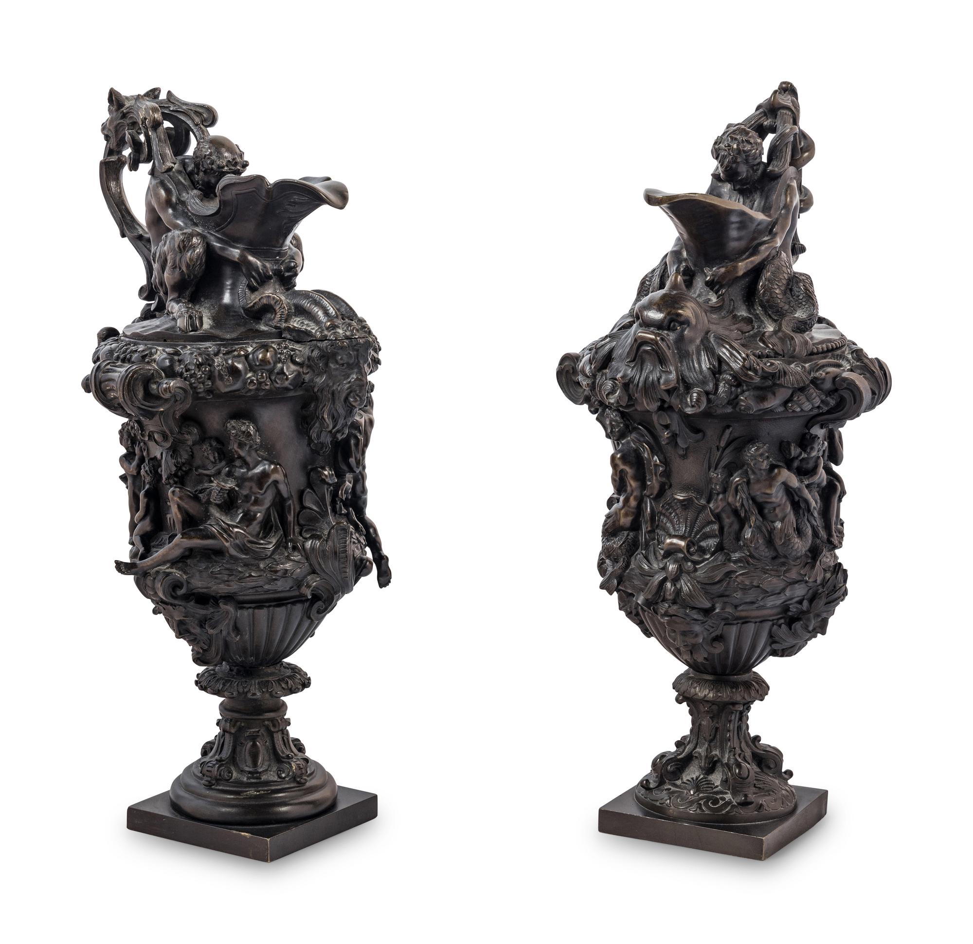 A Pair of Grand Tour Bronze Ewers Emblematic of Water and Earth