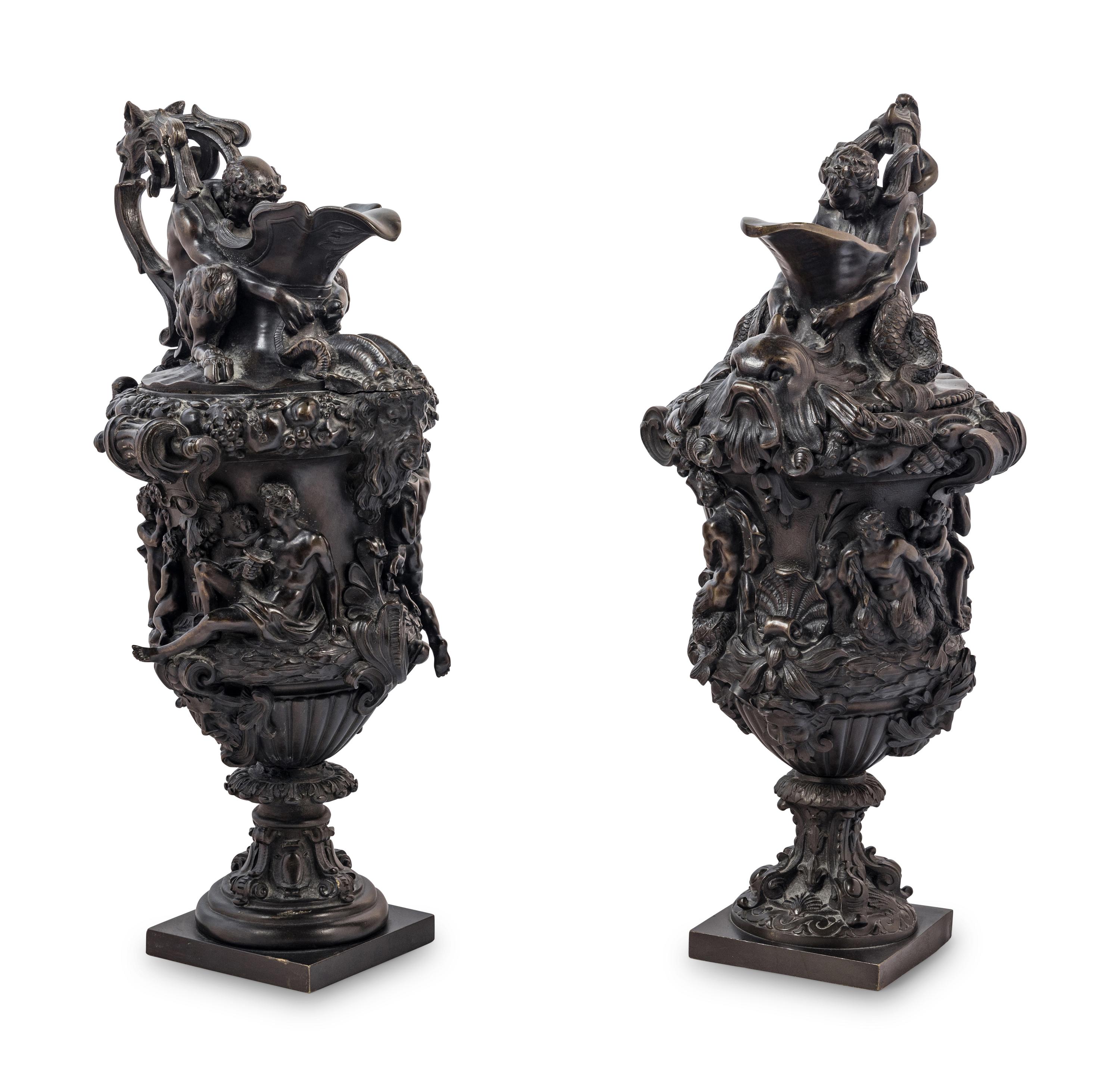 A Pair of Grand Tour Bronze Ewers Emblematic of Water and Earth