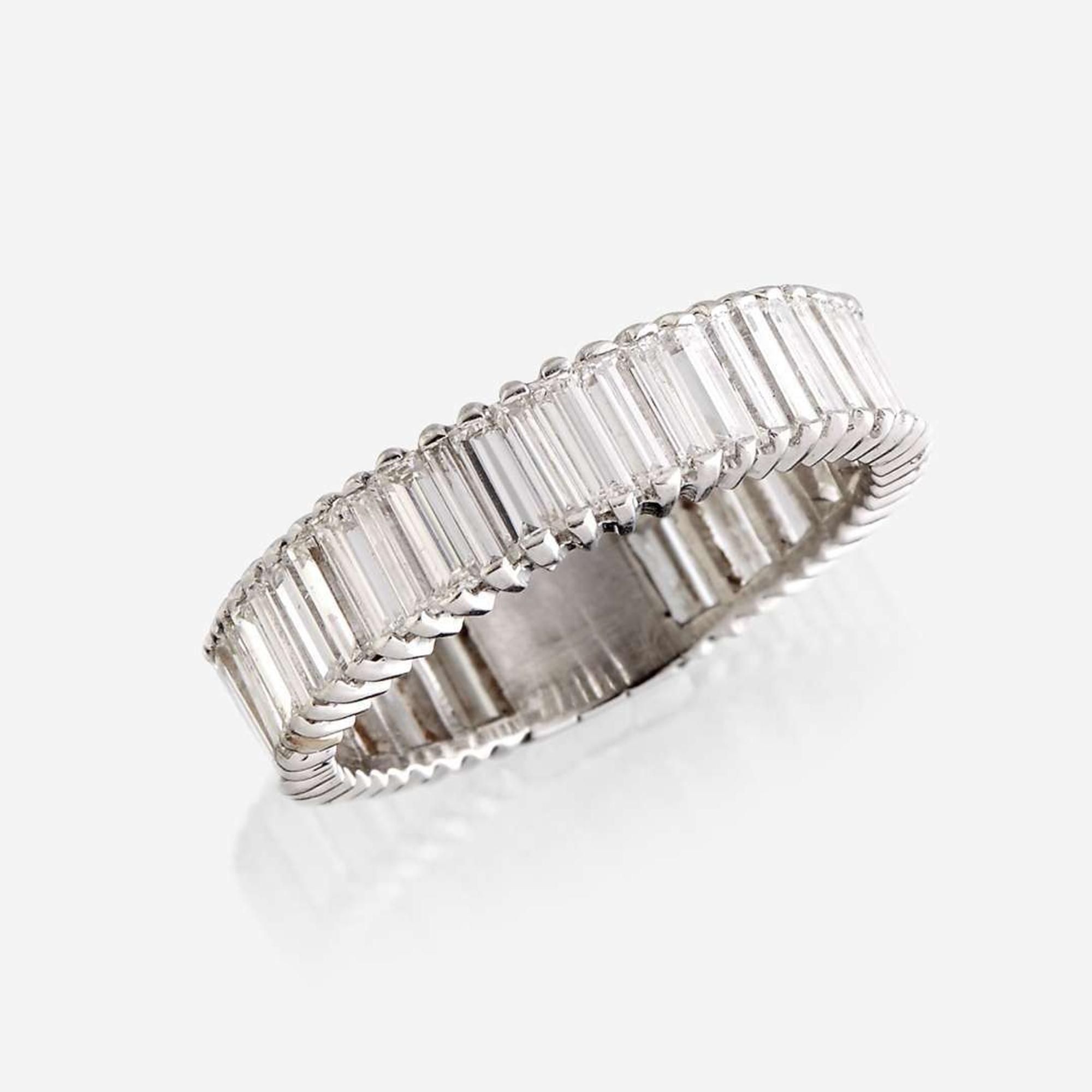 A diamond and eighteen karat white gold ring