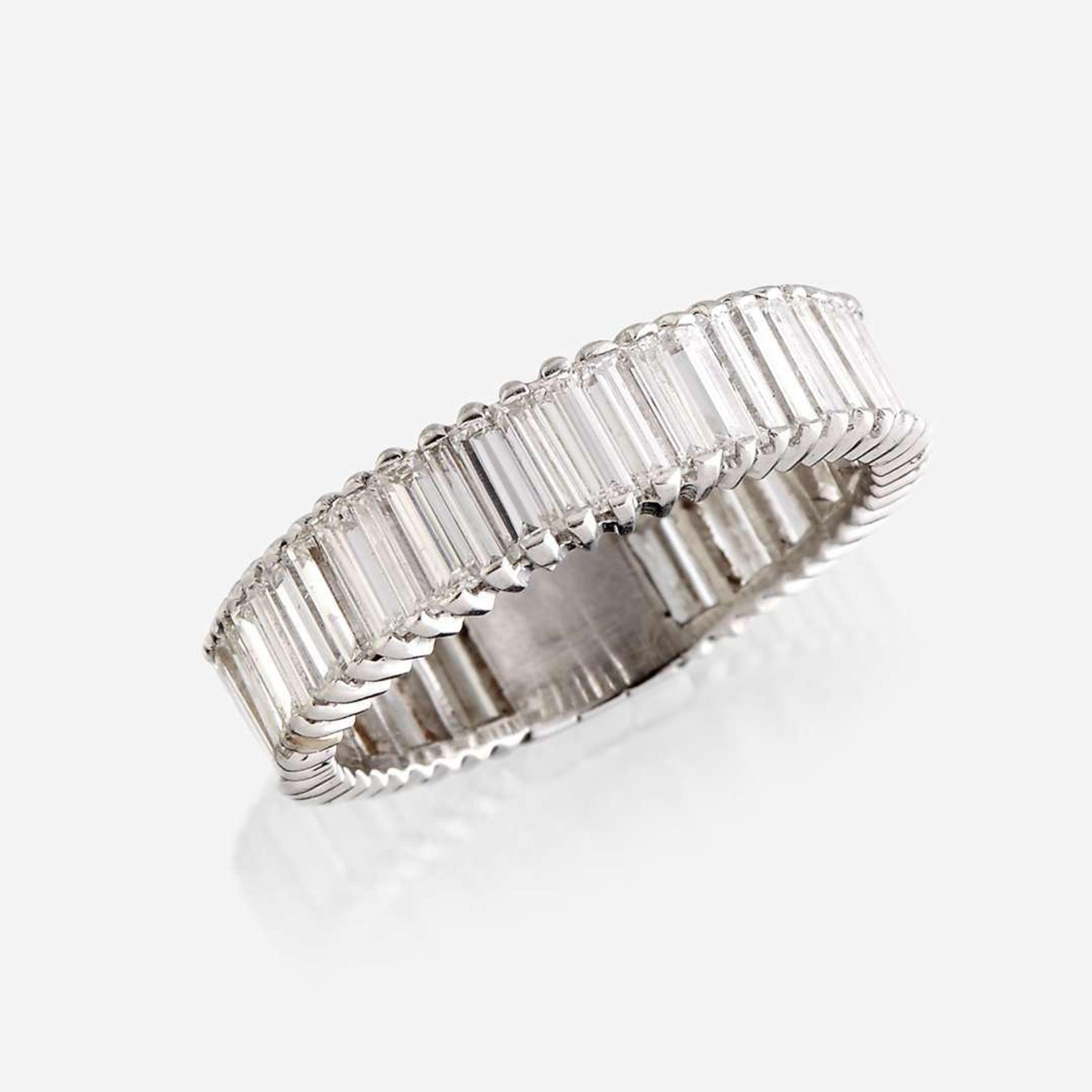 A diamond and eighteen karat white gold ring