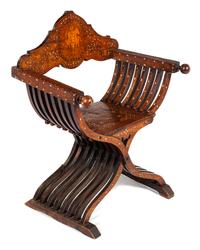 An Italian Mother-of-Pearl, Basswood and Ebony Inlaid Walnut Savonarola Chair Height 36 x width 28 1/2 x depth 20 inches. — LATE 19TH/EARLY 20TH CENTURY