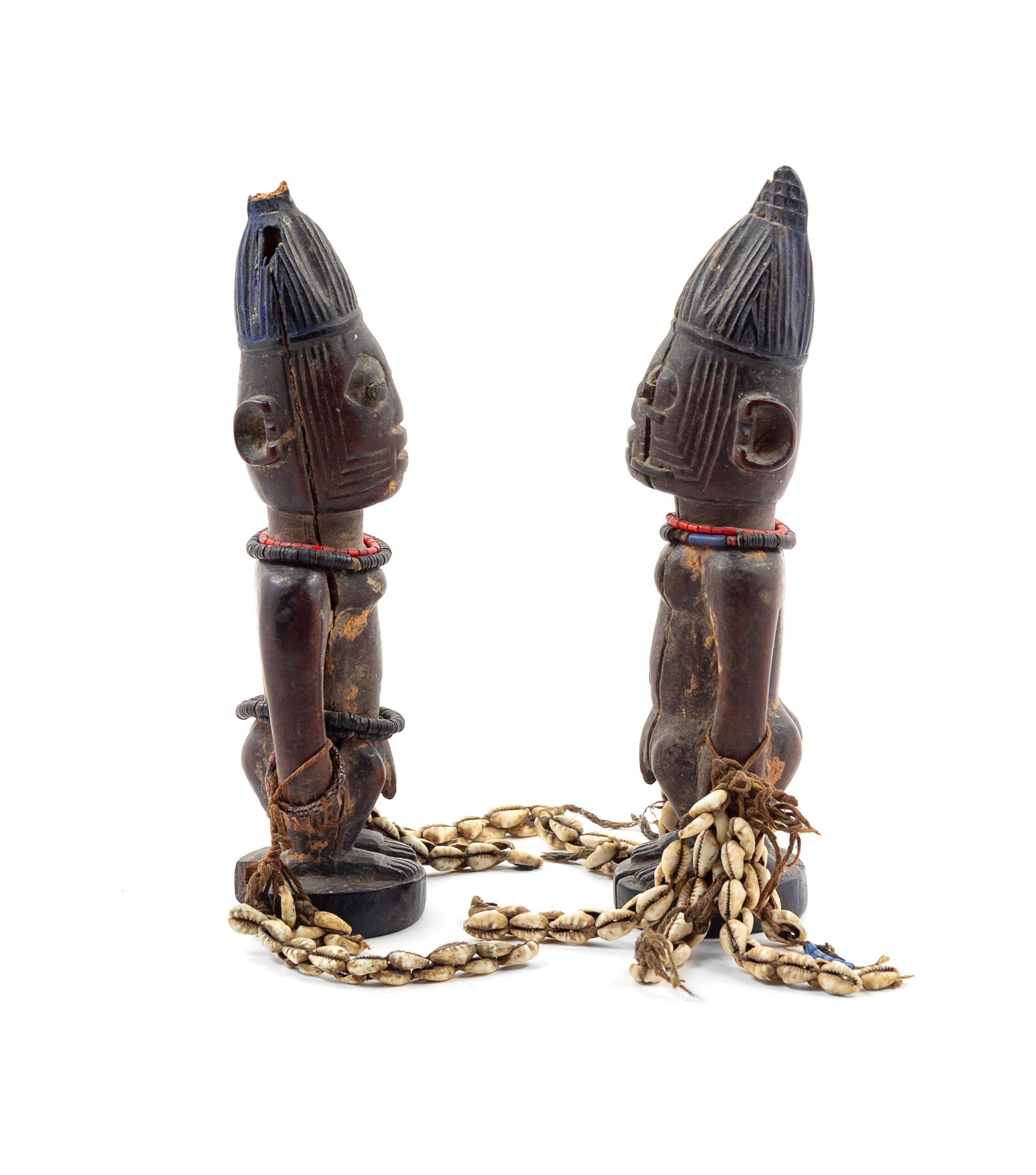 A Pair of Yoruba Twin Ibeji Figures Height 10 1/4 inches. — NIGERIA, PROBABLY MID-20TH CENTURY
