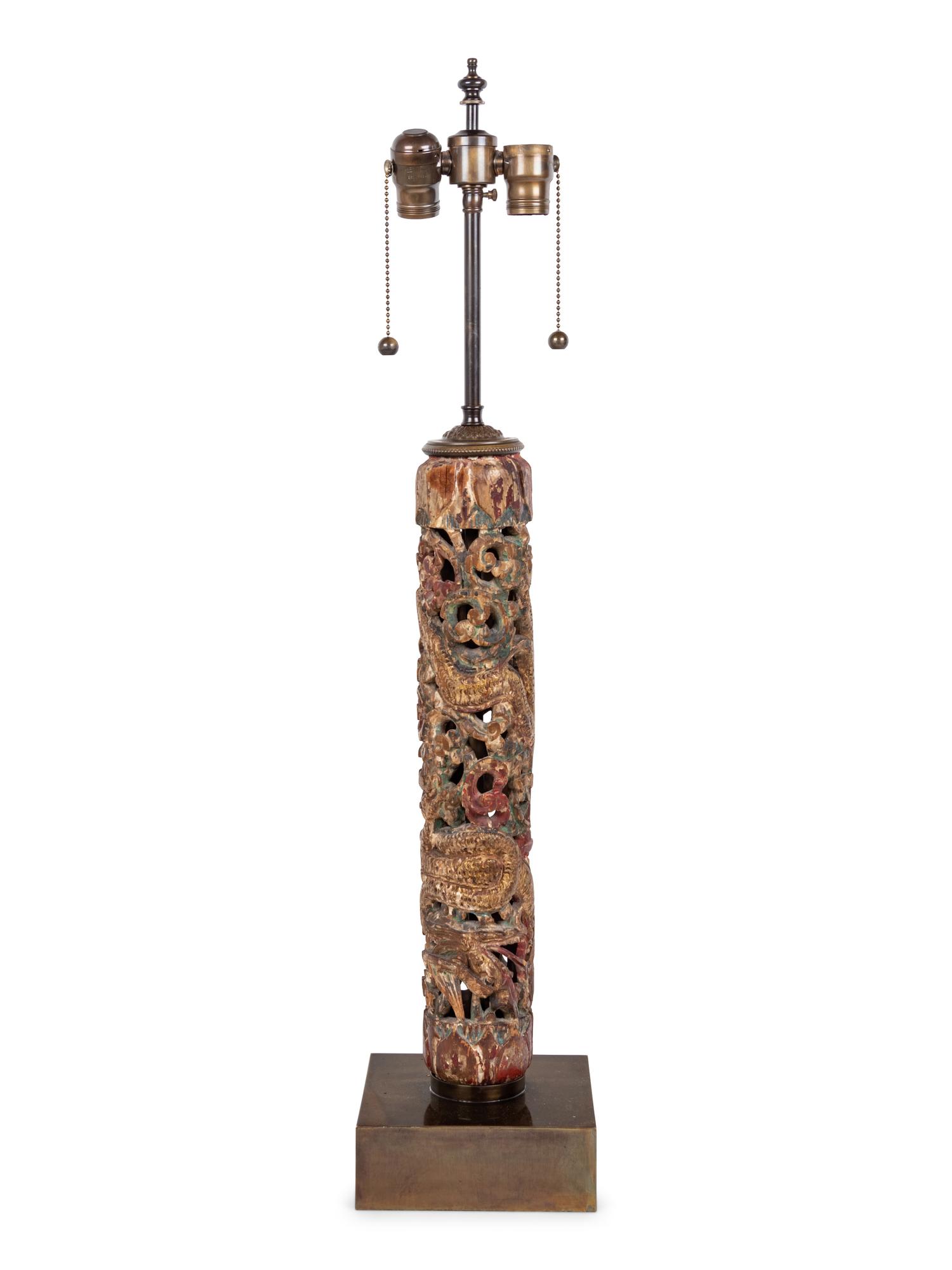 A Chinese Pierce Carved, Painted and Gilt Wood Lamp with a Linen Shade