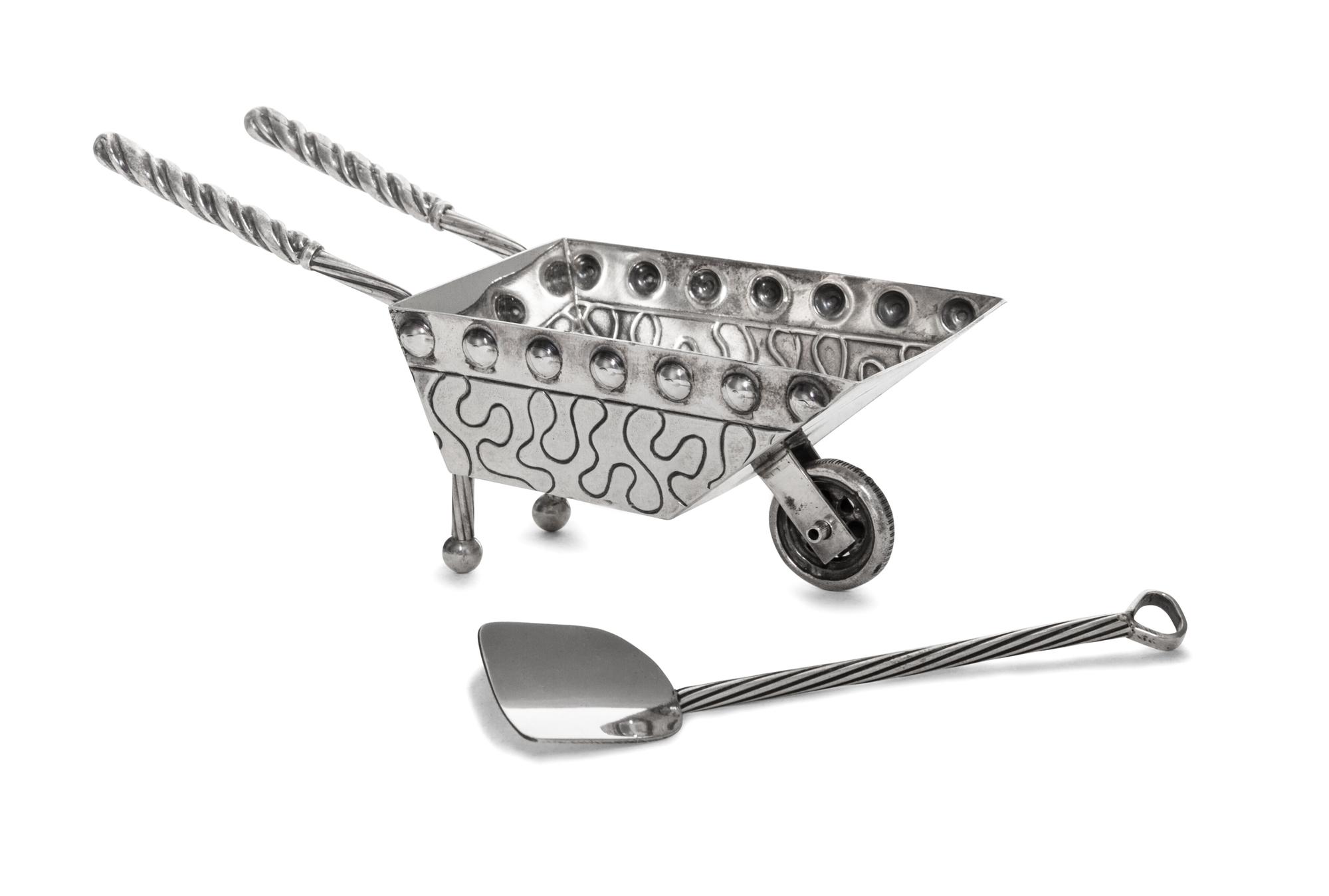 An Israeli Silver Passover Seder Table Article, Netafim, Jerusalem, in the form of a wheelbarrow, together with a shovel-form serving s
