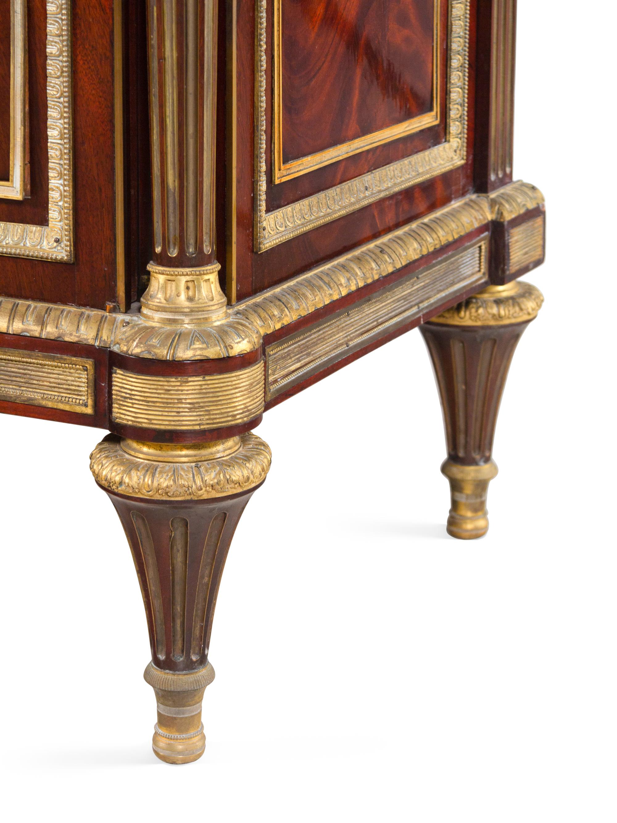 A Louis XVI Style Gilt Bronze Mounted Mahogany Marble-Top Cabinet After the Model by Jean-Henri Riesener (German, 1734-1806)