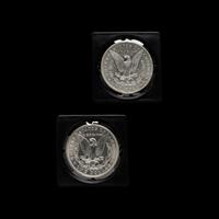 Two 1899-O Morgan $1 Coins