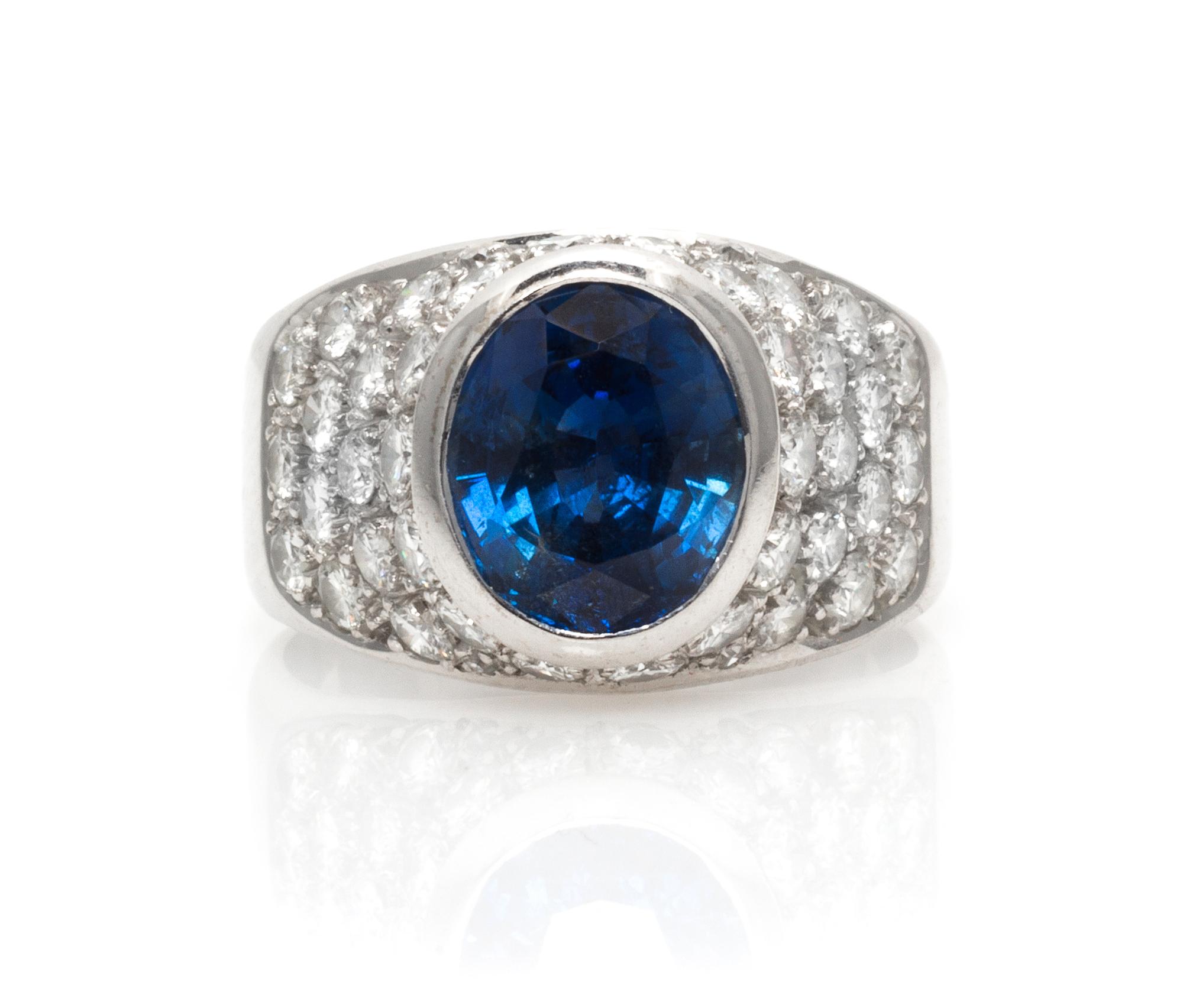 An 18 Karat White Gold, Sapphire and Diamond and Ring, 5.30 dwts.