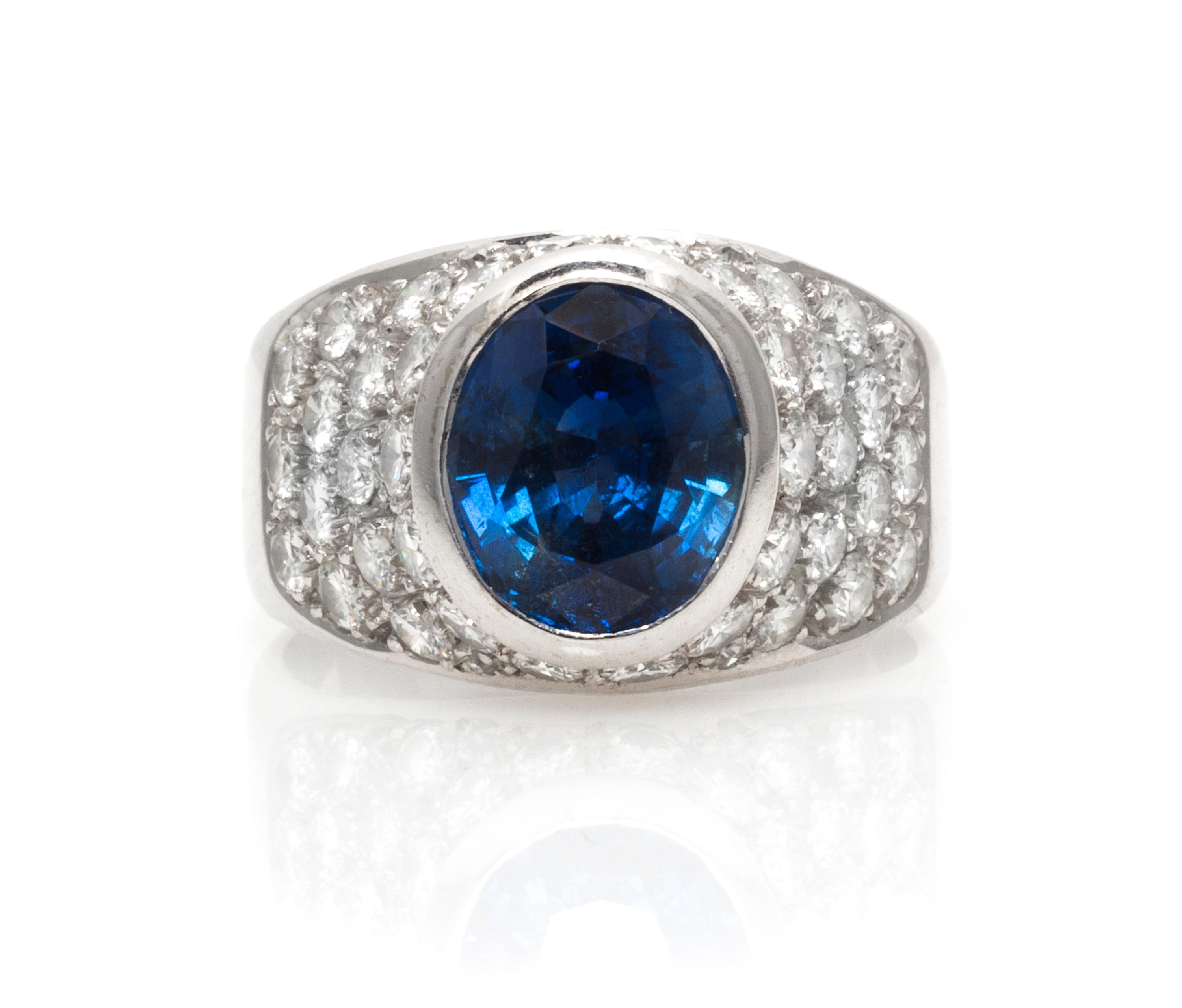 An 18 Karat White Gold, Sapphire and Diamond and Ring, 5.30 dwts.