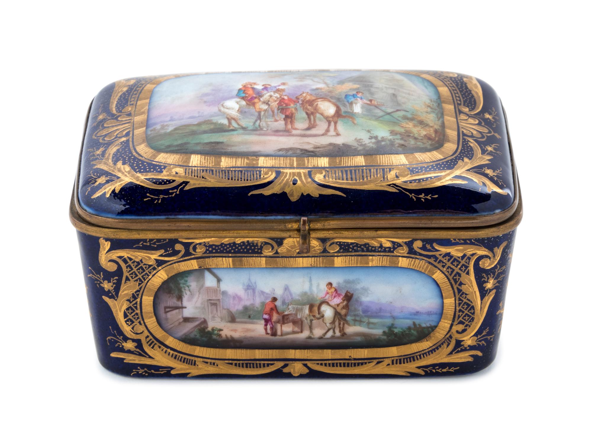 A Sèvres Style Gilt Metal Mounted Painted and Parcel Gilt Porcelain Table Casket