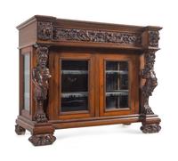 An R.J. Horner Carved Oak Man of the Mountain Serving Cabinet