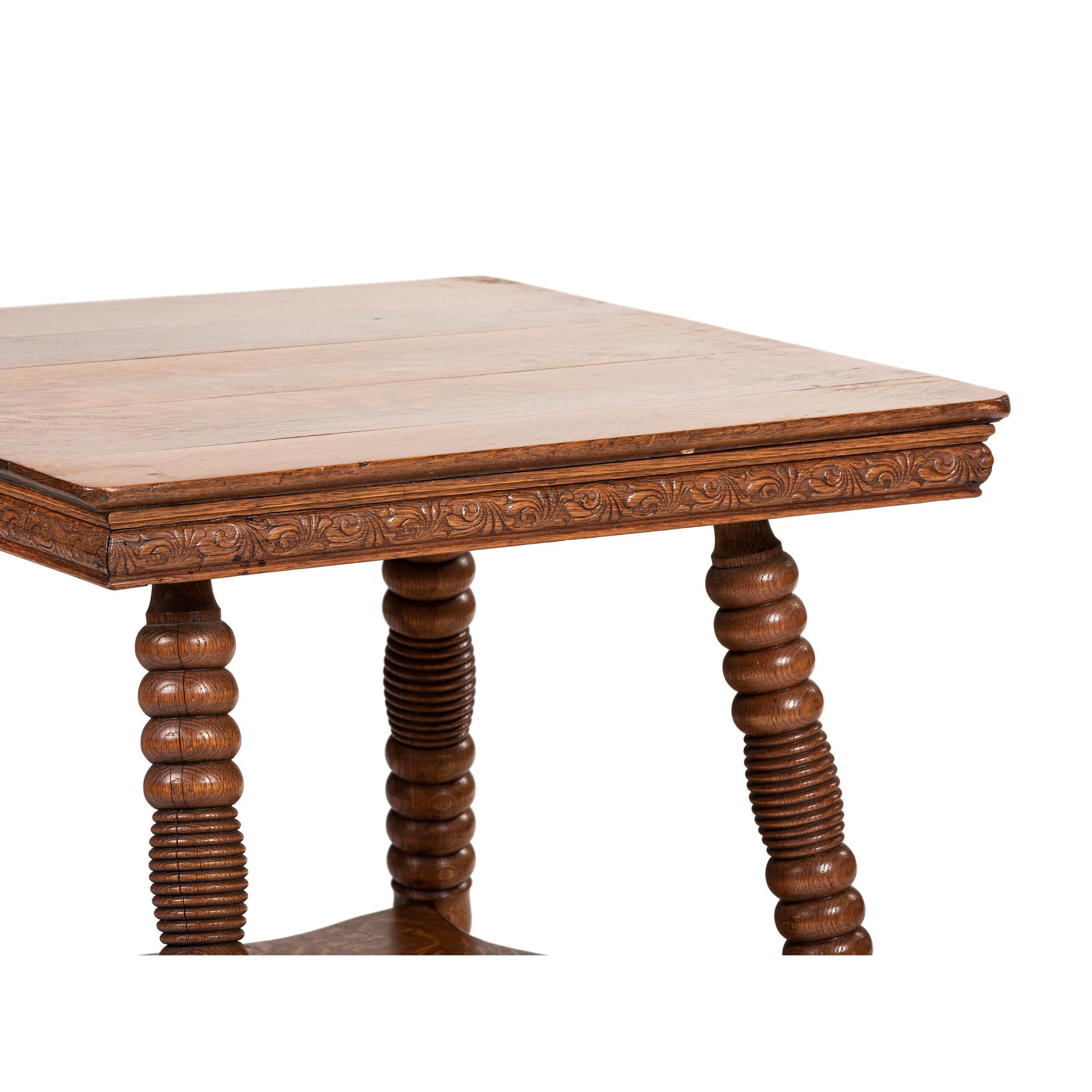 A Victorian Center Table in Oak with Glass Ball and Claw Feet