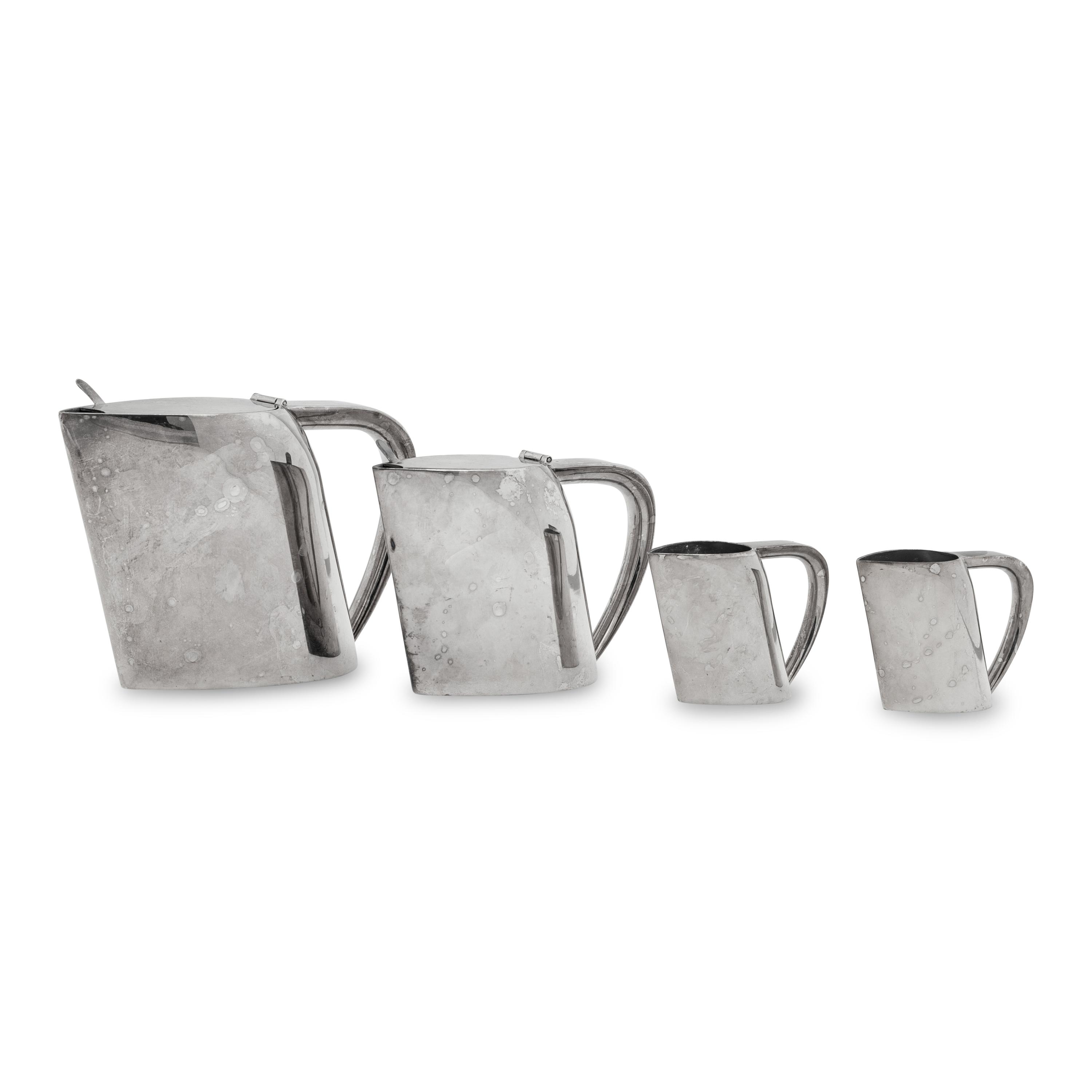 A Group of Four Ercuis Silver-Plate Milk or Cream Pitchers