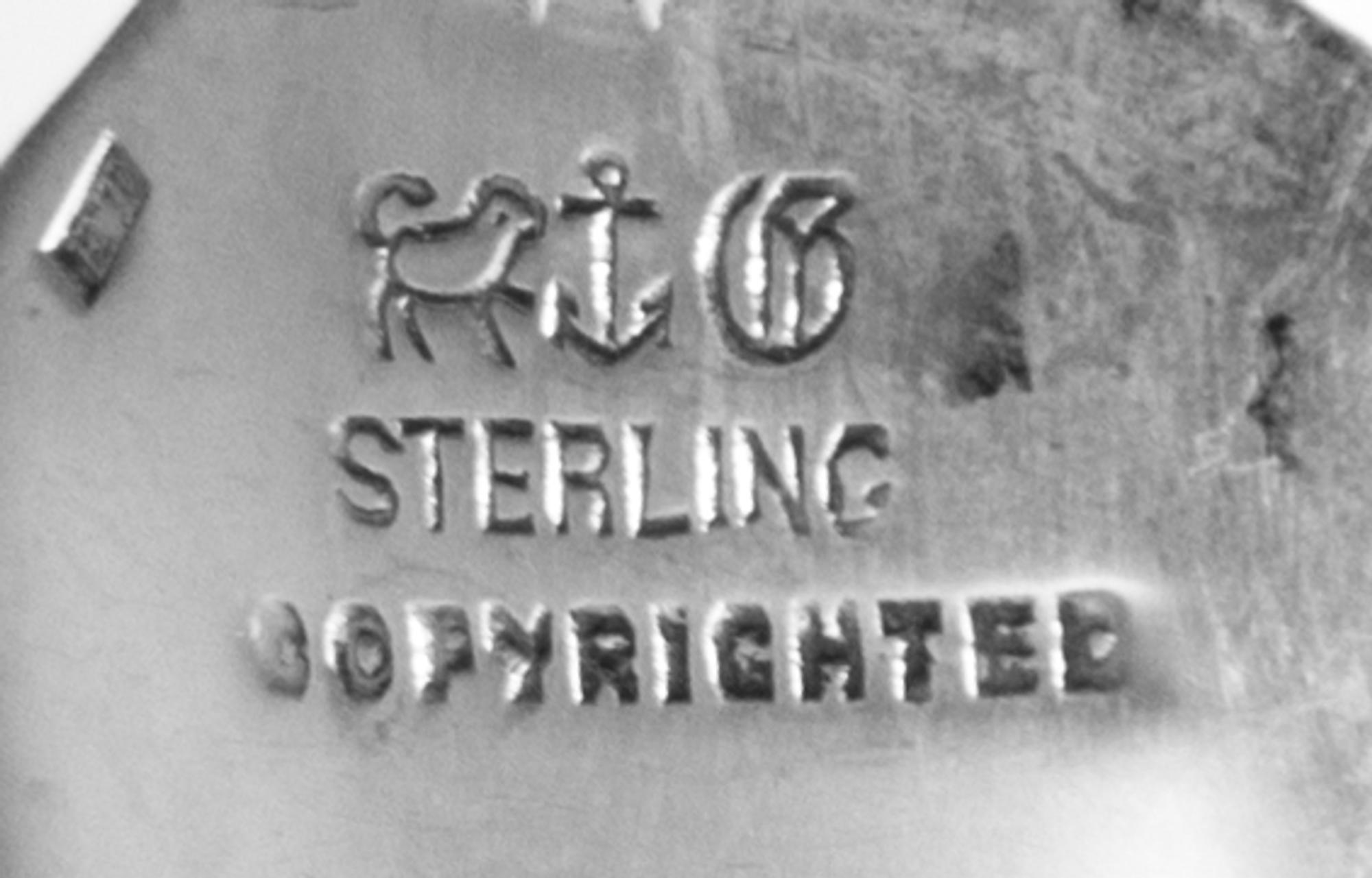 An American Silver Flatware Service, Gorham Mfg. Co., Providence, RI, Versailles pattern, comprising: 12 dinner knives 12 dinner forks