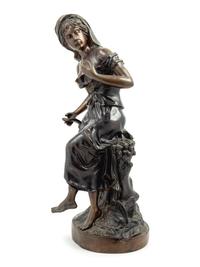 A Cast Metal Figure of A Woman