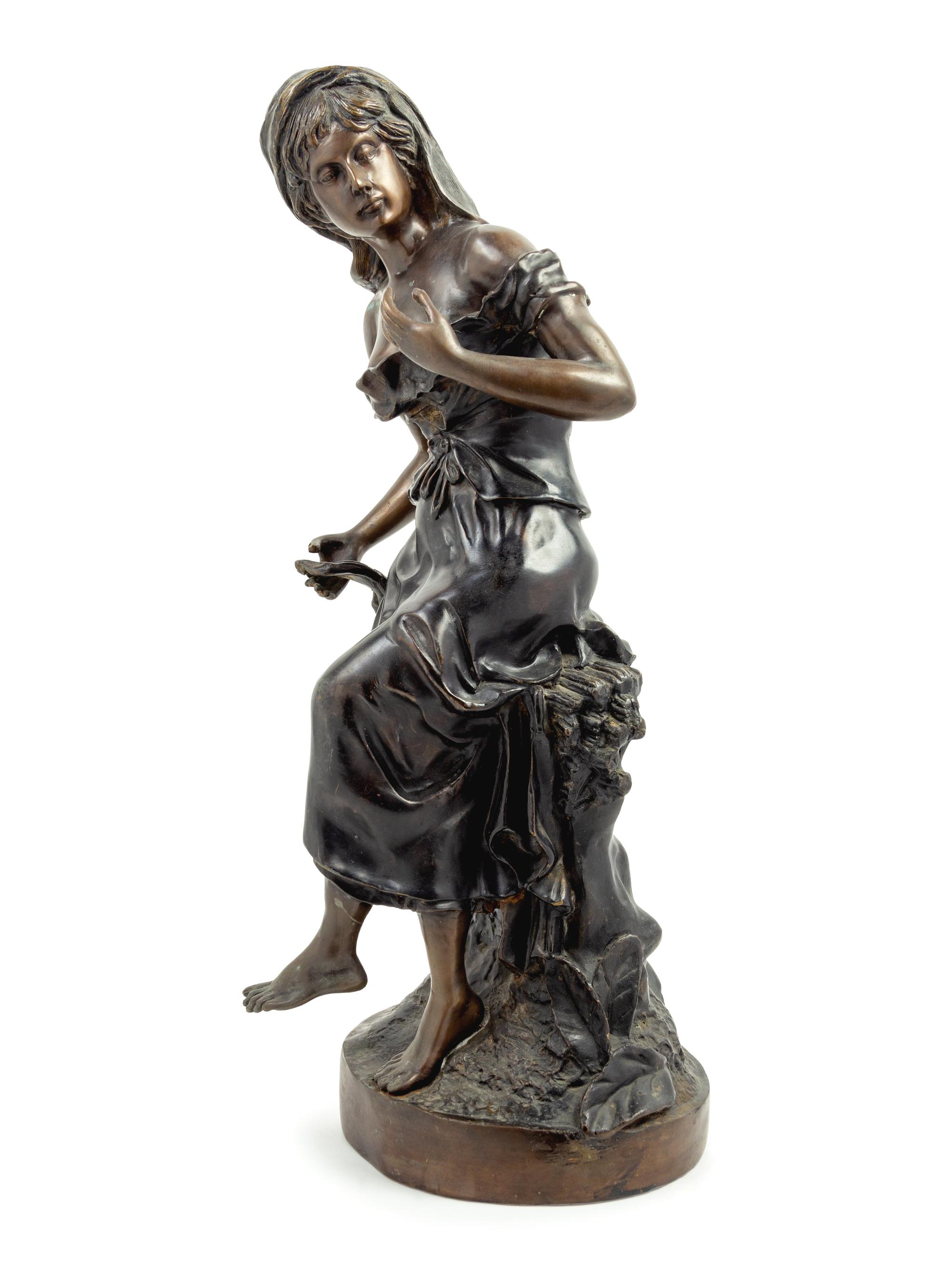 A Cast Metal Figure of A Woman