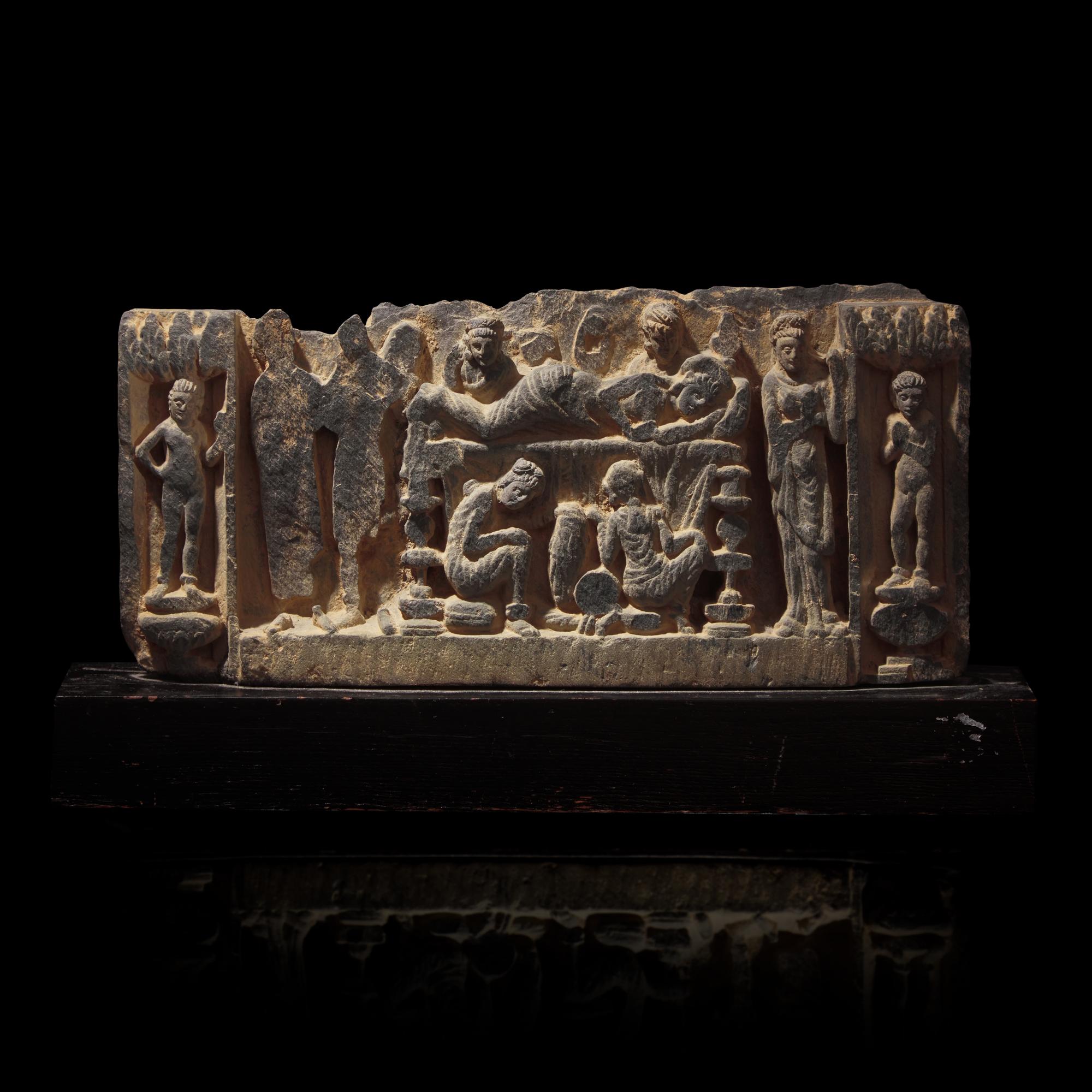 A Gandharan Grey Schist Relief with Maya, 2nd/3rd Century
