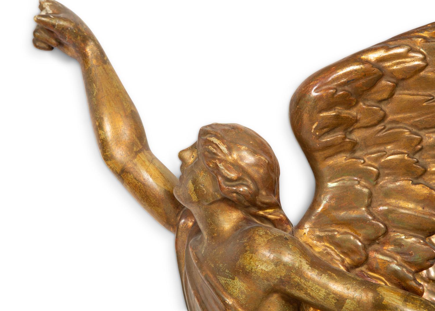 A Pair of Italian Carved Giltwood Winged Angel Appliqués