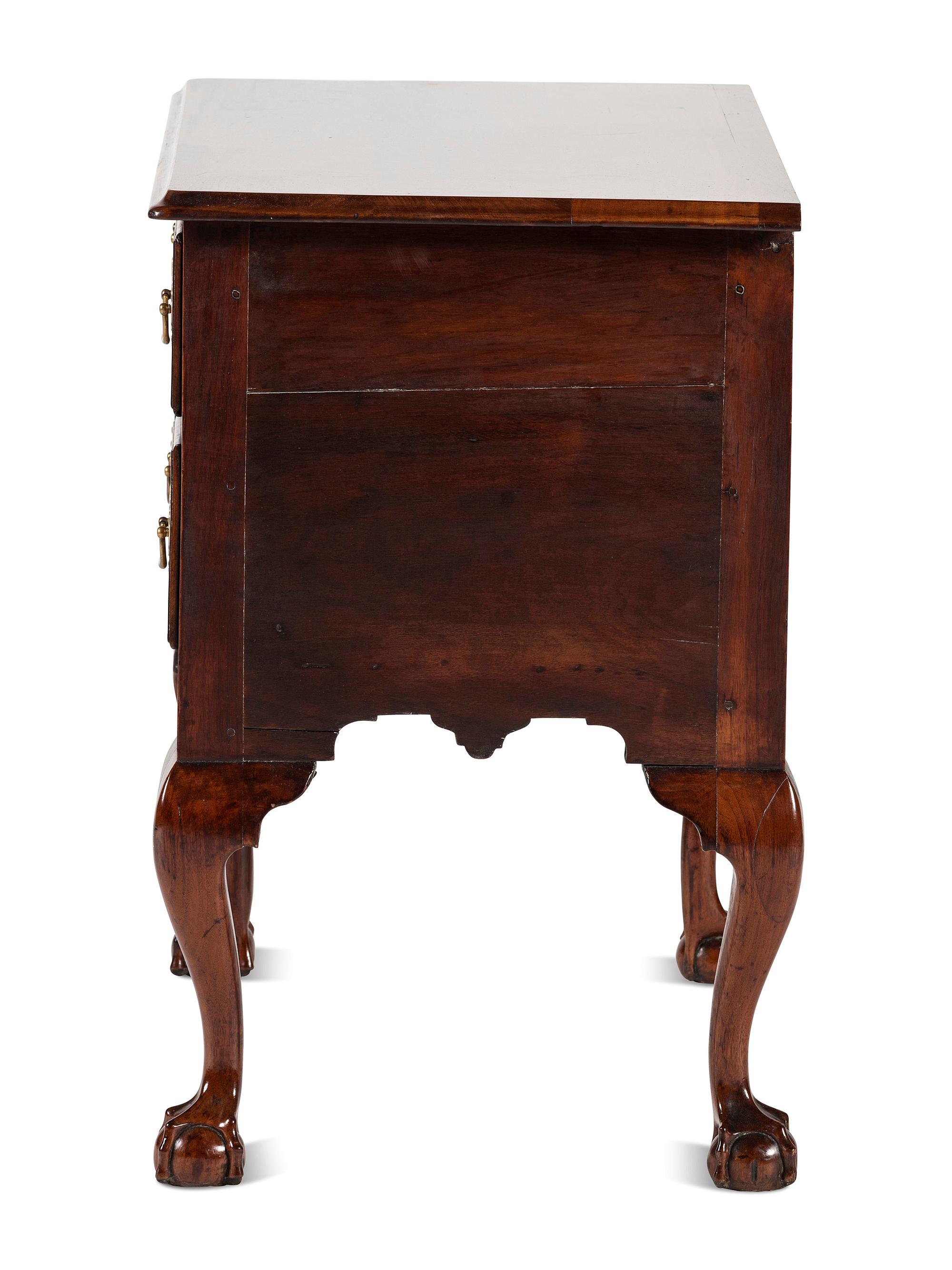 A Chippendale Carved and Figured Walnut Claw-and-Ball Foot Dressing Table