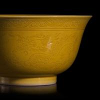 A Group of Five Chinese Incised Yellow Glazed Porcelain "Dragon" Bowls, 19th/20th Century — 清晚期 黃釉暗刻龍紋碗一組五件