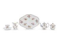 A Sèvres Painted and Parcel Gilt Porcelain Tea Service in a Mahogany and Marquetry Fitted Traveling Case