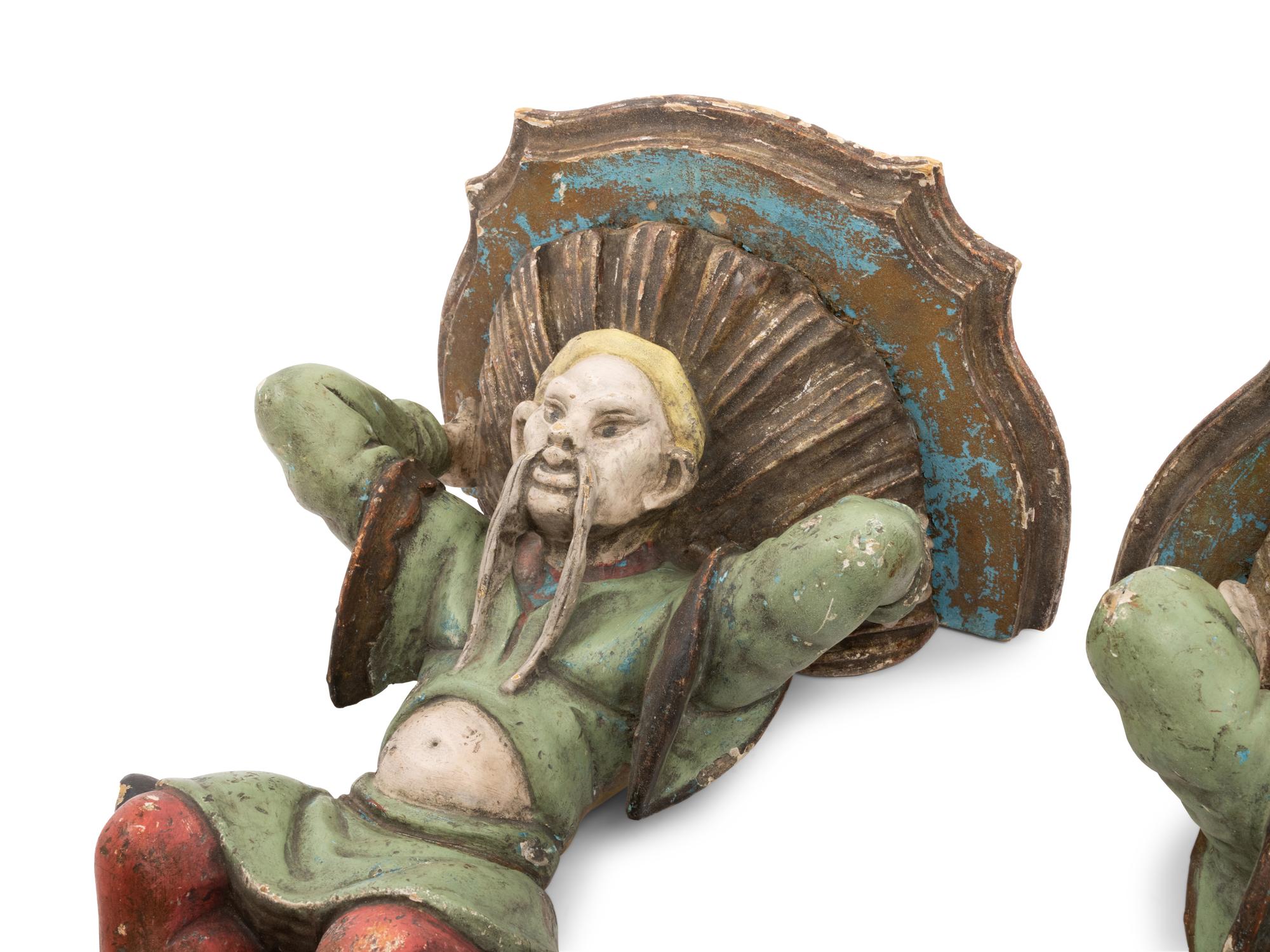 A Pair of Italian Carved and Polychrome Decorated Wood Figural Wall Brackets