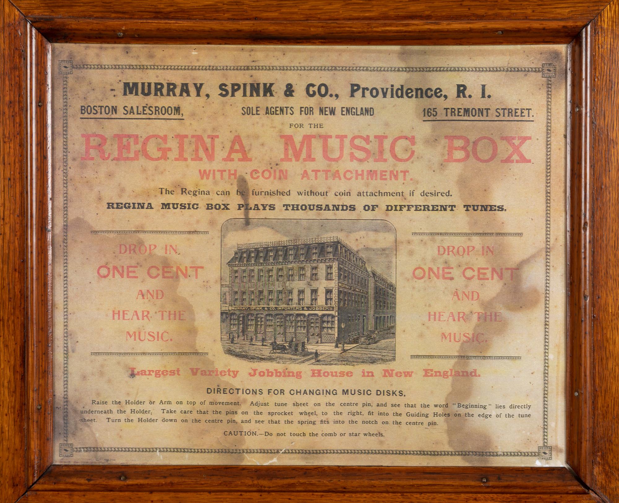 A Regina Coin Operated 15 1/2 Inch Disc Music Box and Stand