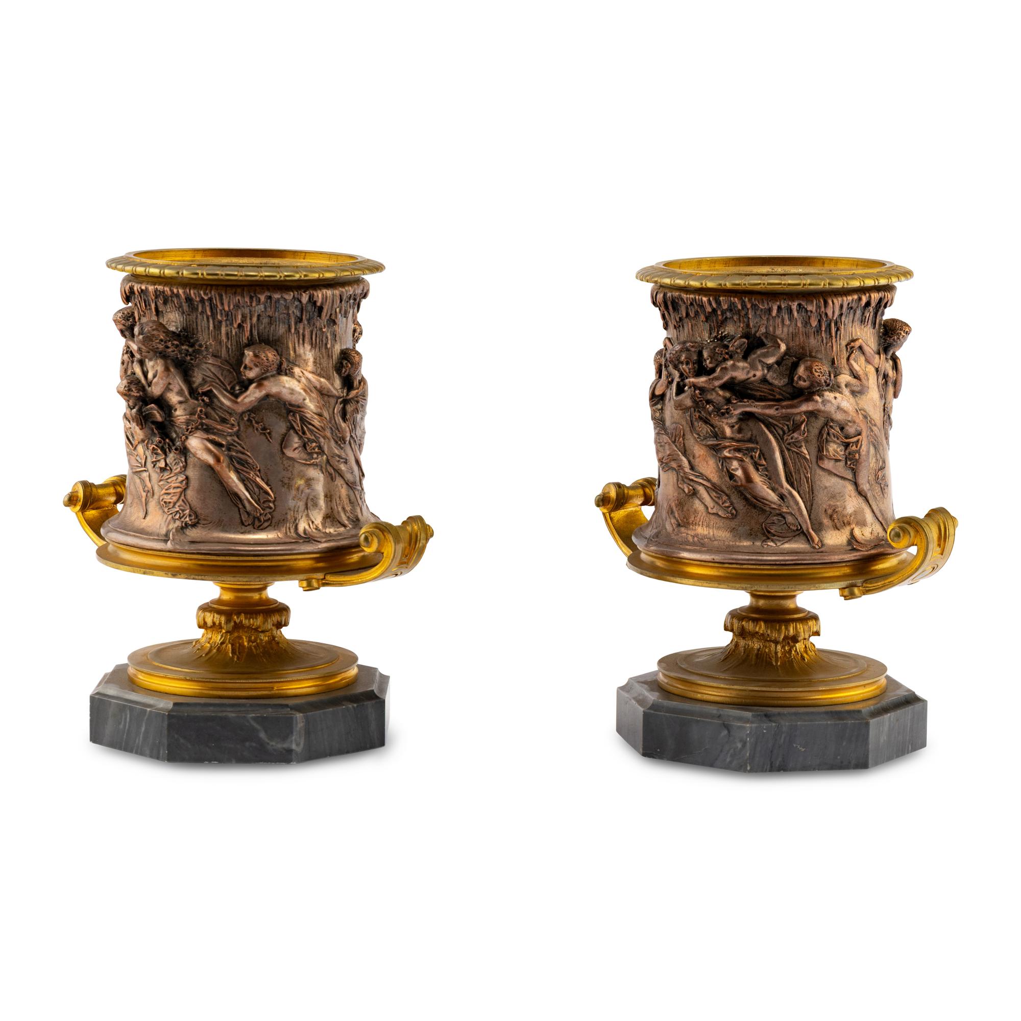 A Pair of French Gilt and Silvered Bronze Urns