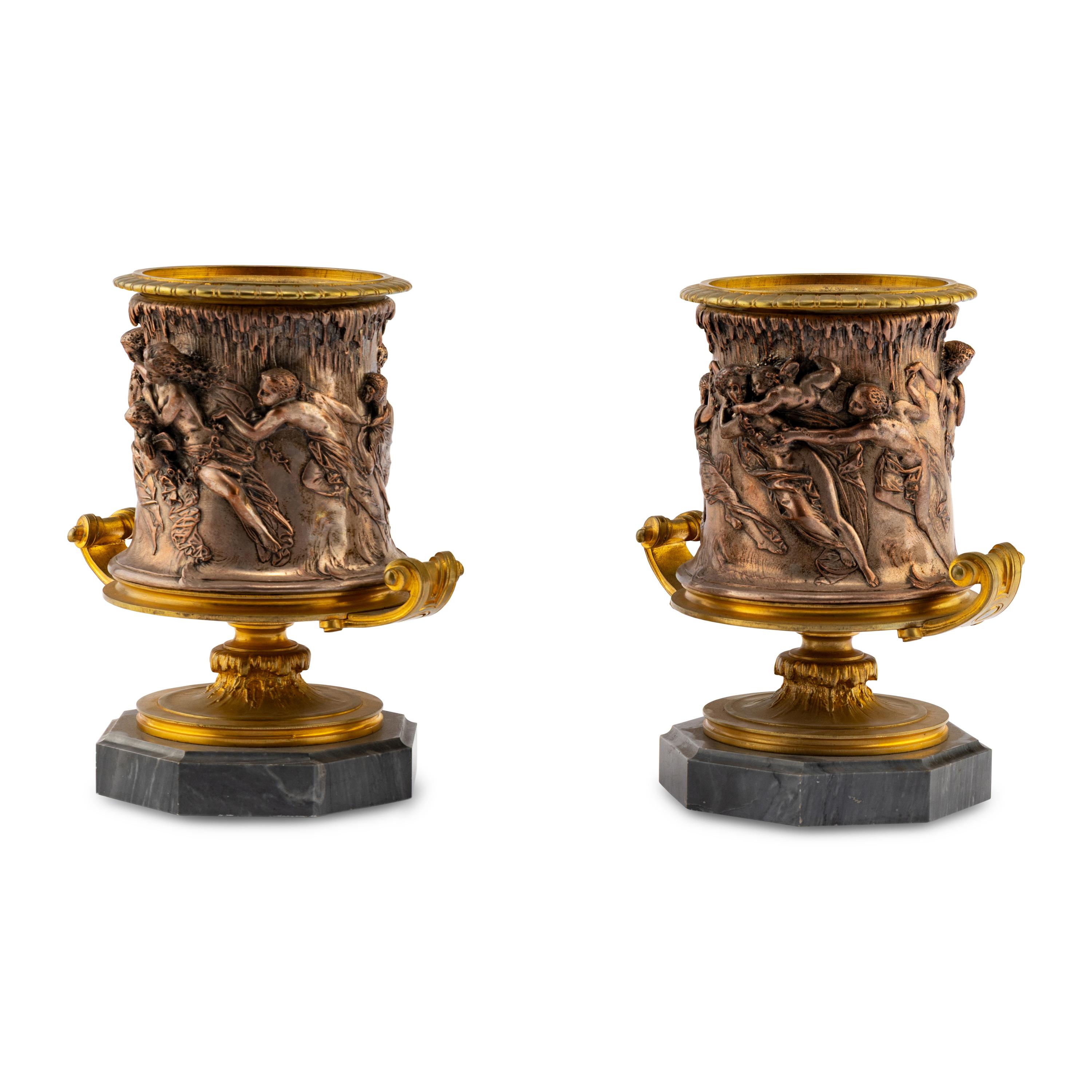 A Pair of French Gilt and Silvered Bronze Urns
