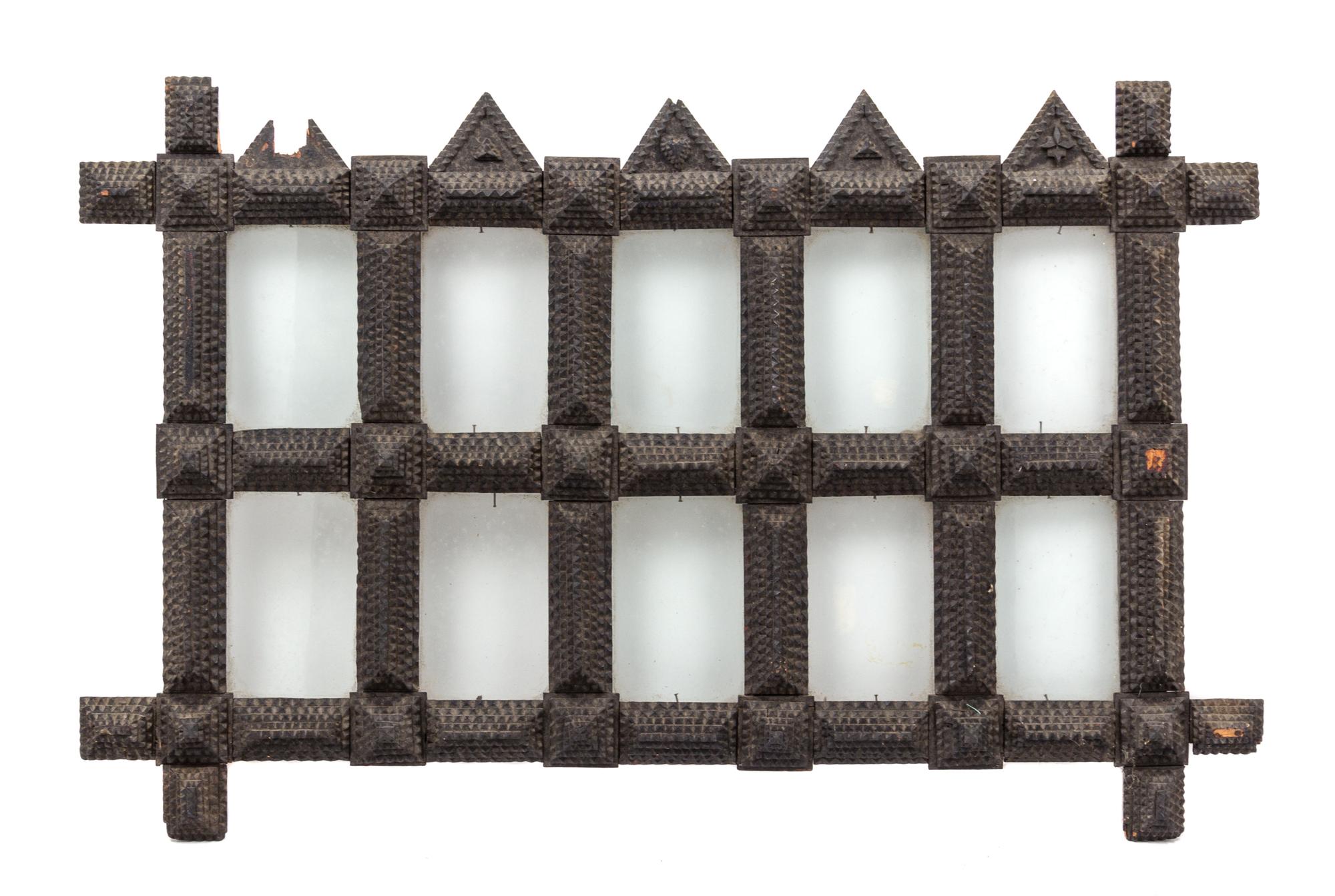 A Tramp Art Carved Wood Picture Frame Height 19 x width 29 1/2 inches.