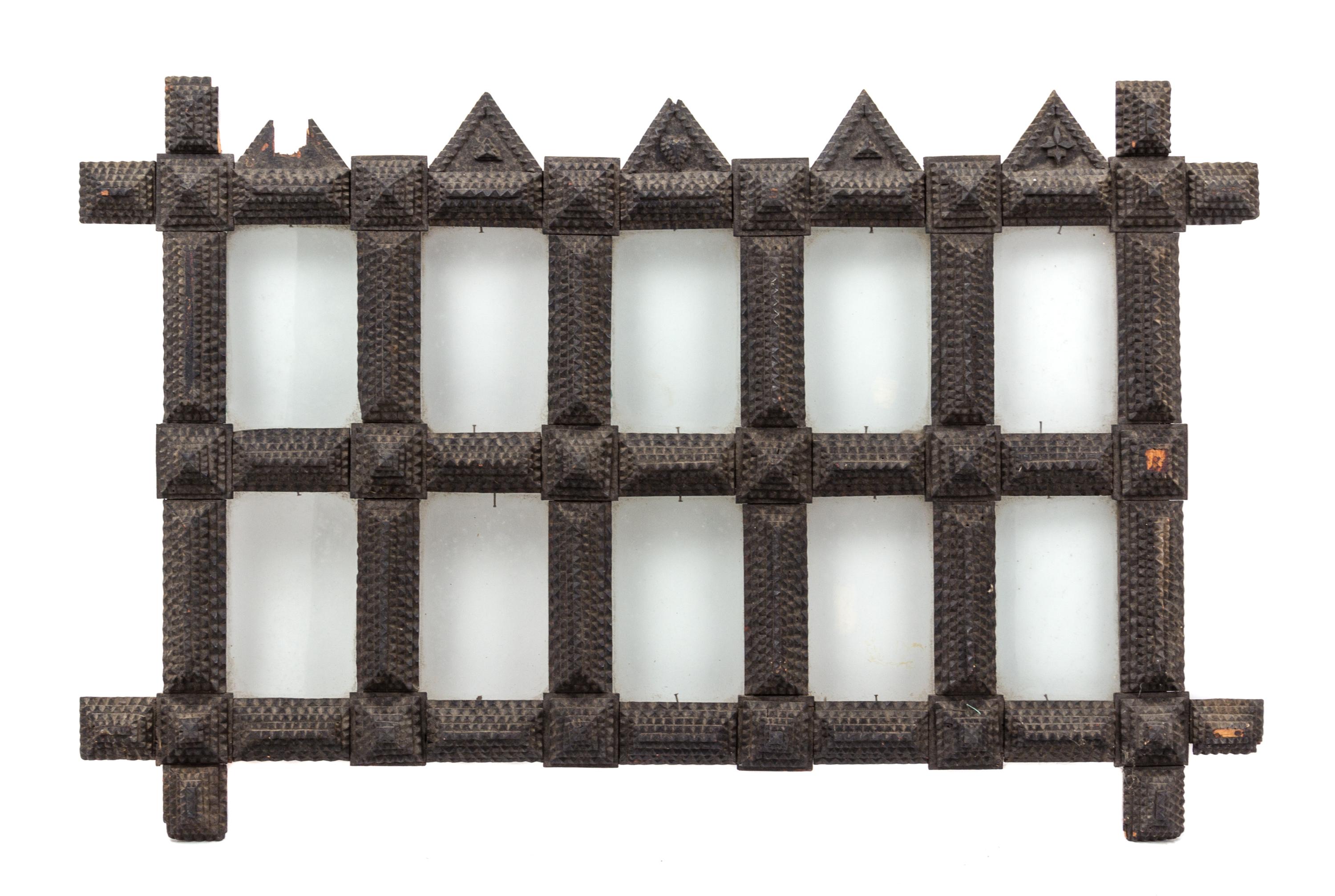 A Tramp Art Carved Wood Picture Frame Height 19 x width 29 1/2 inches.