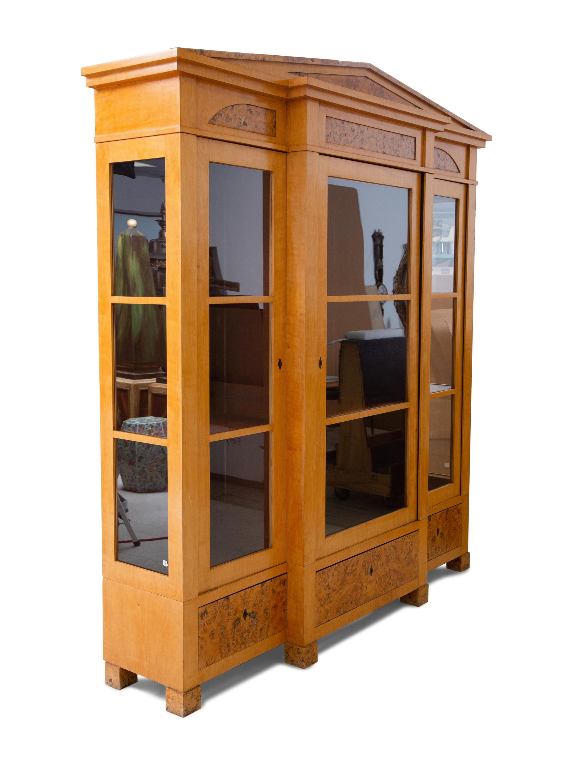 A German Neoclassical Birch Breakfront Bookcase