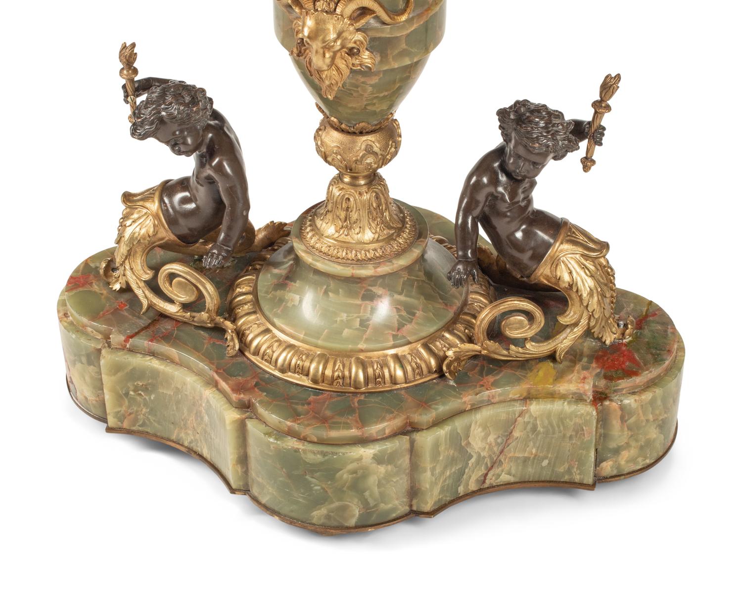 A Napoleon III Gilt Bronze Mounted Onyx and Porcelain Plaque-Inset Table