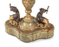 A Napoleon III Gilt Bronze Mounted Onyx and Porcelain Plaque-Inset Table