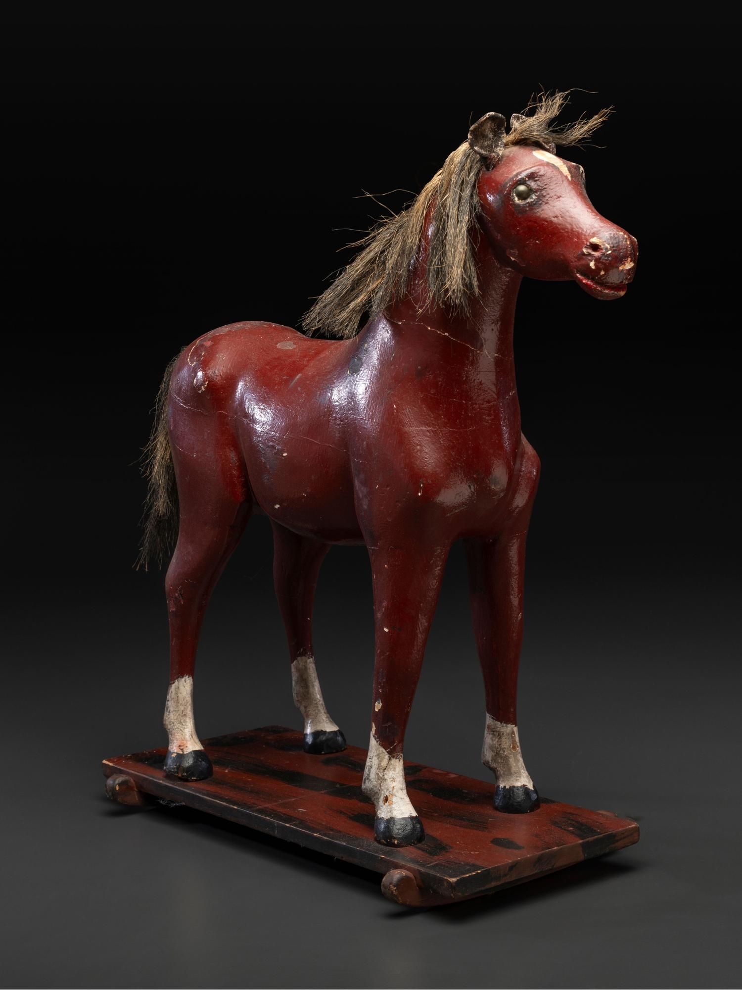 A Carved and Painted Wood Horse Pull Toy