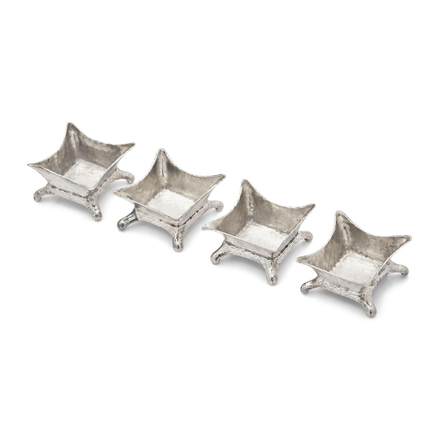 A Set of Four Aesthetic Movement Hammered Sterling Silver Salt Cellars