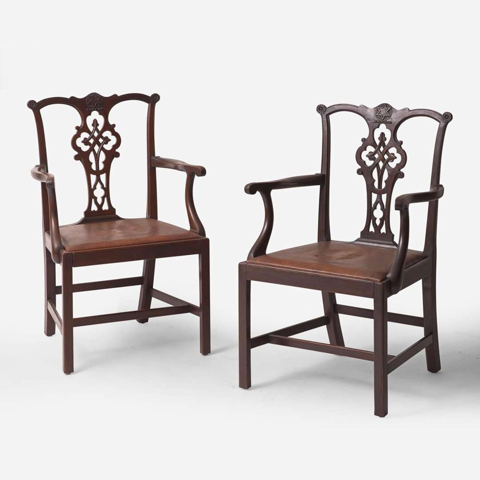 A pair of Chippendale style carved mahogany armchairs late 19th / early 20th century