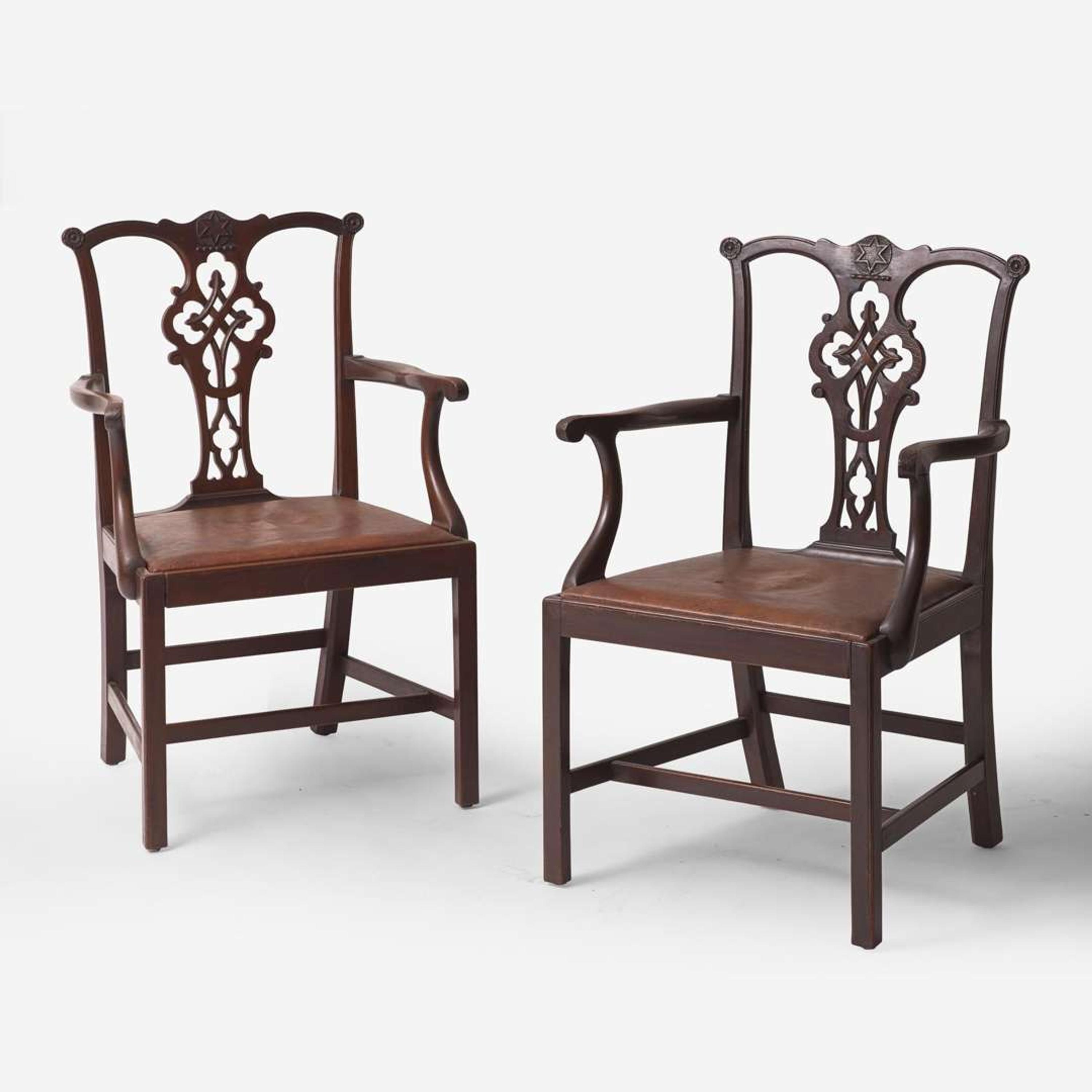 A pair of Chippendale style carved mahogany armchairs late 19th / early 20th century