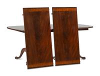 A George III Style Carved Mahogany and Satinwood Dining Table