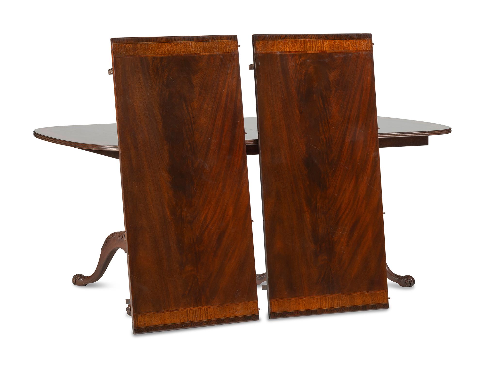 A George III Style Carved Mahogany and Satinwood Dining Table