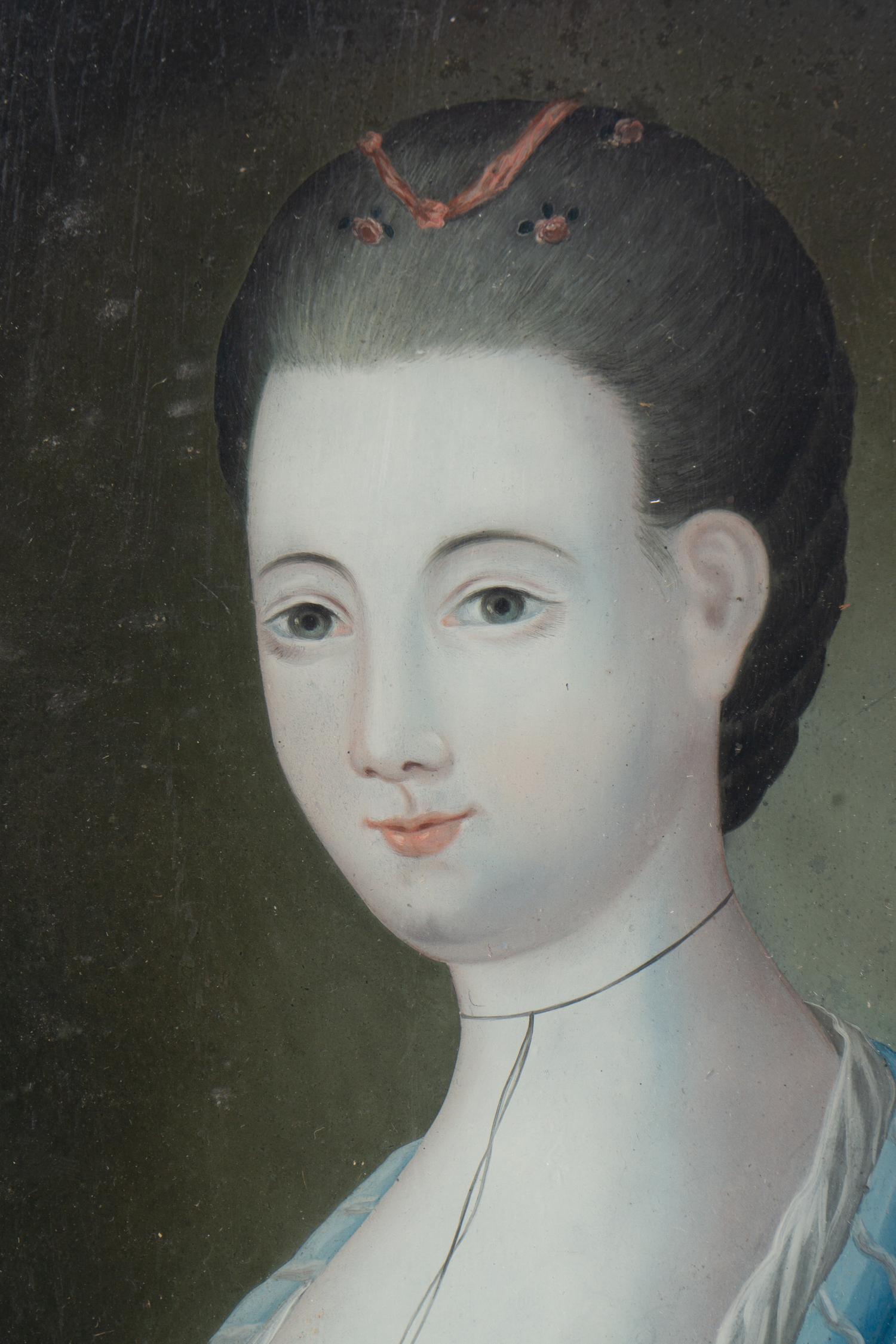 A Pair of English Reverse-Painted Glass Portraits