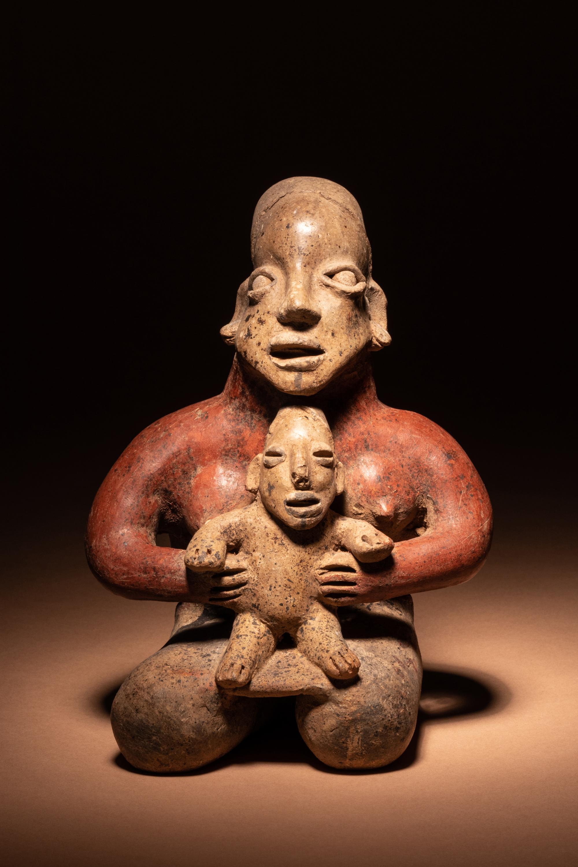 A Jalisco Kneeling Female Figure with Infant